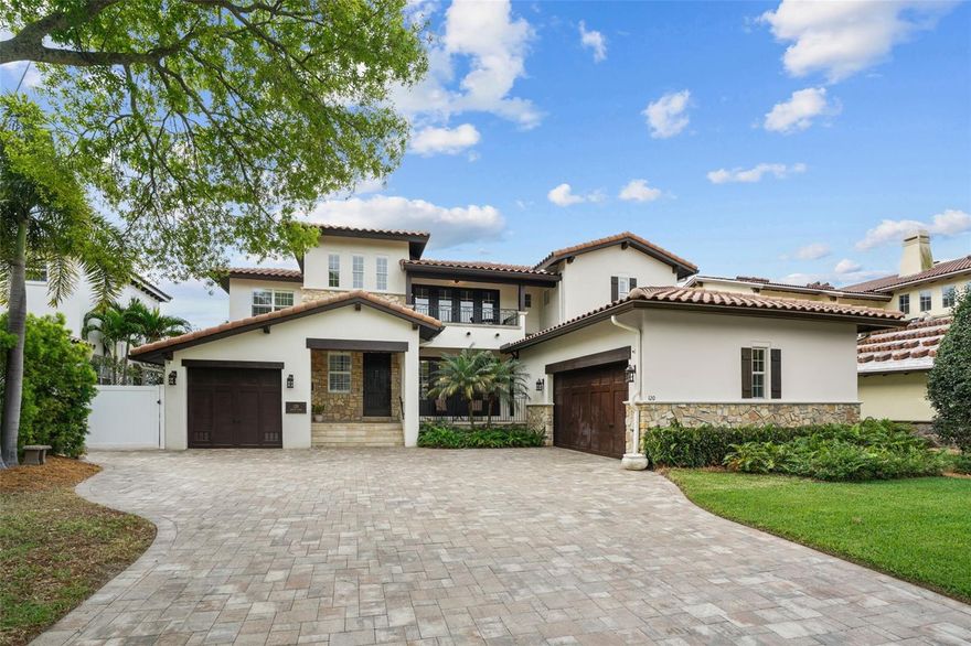 This beautiful, Tuscan style, single family home has recently renovated Kitchens, baths, and flooring and sits in a great Davis Islands location. With 5 bedrooms, 3.5 baths, 3 car garage and a golf cart parking, this home features first floor master bedroom suite, tile roof, brick pavered driveway, and front entry with a gorgeous 8' Mahogany styled door. As you enter, there is a dramatic foyer with two story ceilings and stained solid oak stairway with iron railing. On the first floor, there is a huge dining room with cast stone gas fireplace, large mantel, and pass thru to kitchen complete with cabinetry and wine rack. Functional living/greeting area is located just off the dining room. The completely remodeled kitchen features white cabinets, quartz countertops, center island with vegetable sink, Pot filler at Wolf cooktop, stainless appliances including built-in refrigerator, gas cooktop, warming drawer, and under cabinet lighting; secondary staircase with iron rail leads off breakfast area and kitchen. The spacious family room with two story ceilings and lots of light is just off the kitchen and is great for entertaining family and friends. Both the family room and dining room overlook the screened in lanai with bead board wood ceiling and beautiful pool/spa. The first floor master suite has French doors to screened lanai; New master bath has freestanding tub, Quartz countertops, split sinks, vanity areas, and huge walk-in closet with California style shelving. A 2nd guest bedroom or den finishes off the first floor. Upstairs there is an oversized bonus room or loft with balcony overlooking the front lawn and full wet bar including ice machine and dishwasher. Three spacious bedrooms, one with an en-suite bath and hardwood floors are located upstairs. A wonderful home just a short distance away from Davis Islands village with many restaurants, shops, and bars. Bring your golf cart and enjoy the Island lifestyle with walking / biking paths, baseball fields, public tennis courts, public historic pool, two dog parks, a beach, public marina, and an airport. Additionally, being located only minutes from Downtown Tampa, Water Street's Sparkman Wharf, and the Tampa Riverwalk, makes this neighborhood the most desired in South Tampa.