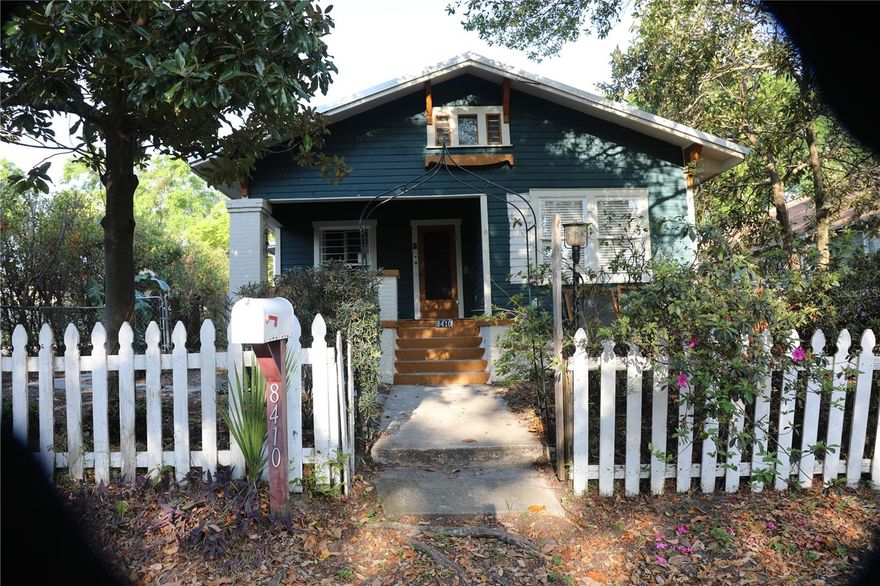 Unique property!  If you are looking for an original Florida Bungalow, this is an amazing opportunity!  All the original charm, moldings and built-ins remain intact.  Potential for three rental incomes.  This unusual property has a basement with an additional bedroom, bathroom, den and walk-in closet along with a huge storage space.  The property is graced by lovely foliage and fruit trees, a picnic shelter with a brick barbecue and a metal roof that was built a century ago!  Pavered patio makes this a great place for family gatherings.  A second adjoined lot on the back of the property that is perfect for a garden or building townhomes and cashing in on the profits estimated at $1.2M after a generous allowance for construction costs.  This property has an EV charging station, a separate covered carport, and a detached garage with an income-producing furnished studio apartment on the second floor.  A workshop in the single car garage adds to the utilitarian features. Appliances are 3 years old and top of the line. Propane range and clothes dryer.  Also a garden window in the kitchen.  Ceiling fans in all rooms with picture holdings that have hooks and cables so walls are unmarred.  Built-in bookcasees and china cabinet add to the 20's charm.  Solar makes the electric bills next to nothing - literally $25-35/month!  Full house water filtration.  A/C is three years old and includes healthy UV air system.  Plumbing, electrical, metal roof are all less than 10 years old ensuring many years of worry-free living just 4 miles to downtown Tampa!  New decorator paint inside and out, new front porch decking, new carport metal roof too.  Termite tented in 2022. Mature trees create a very private environment.  Quiet neighborhood just blocks to Seminole Heights stores and restaurants.  One block to the bus stop as well.  Easy access to I-275.