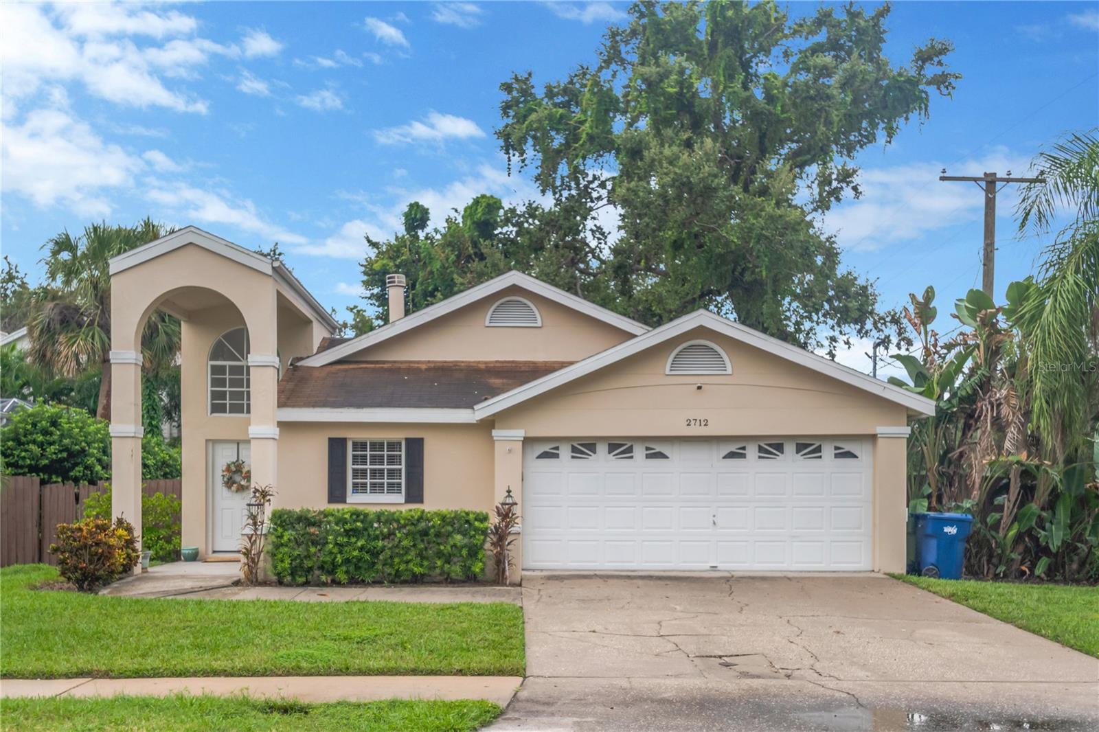 Beautifully Updated 3-Bedroom Home in Highly Sought-After Ballast Point! Welcome to this move-in-ready 3 bedroom, 2 bath home with a 2-car garage in the desirable Ballast Point neighborhood. Thoughtfully updated and well-maintained, this home combines modern style with inviting charm. The kitchen features granite countertops, a stylish backsplash, breakfast bar, and stainless steel appliances. The heart of the home is the double-sided fireplace, creating a warm, cozy connection between the dining room and living room. Vaulted ceilings and skylights fill the space with natural light, enhancing the open, airy feel. The spacious primary suite includes a sliding barn door leading to the updated en-suite bath with granite dual vanities, a walk-in shower, and a massive walk-in closet. Outdoor living is just as inviting with a screened lanai, a charming pergola with café lights and privacy curtains, and a fully fenced yard with mature landscaping and decorative rock pathways—perfect for relaxing or entertaining. Located minutes from top-rated restaurants, shopping, schools, MacDill Air Force Base, the Selmon Expressway, Bayshore Boulevard, and an easy commute to Downtown Tampa and Tampa International Airport. Schedule your private tour today and discover the comfort, style, and location you’ve been waiting for!