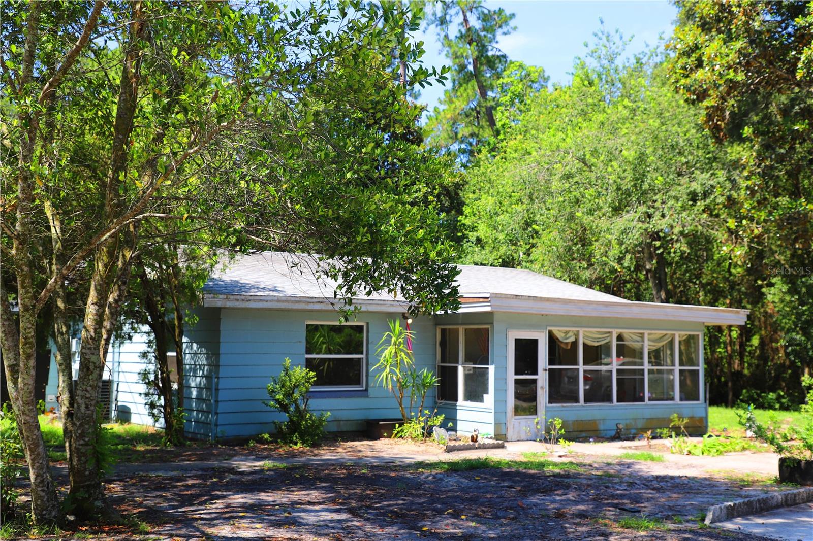 Country living! This 3 bedroom house near the Ocala Trail can be yours for ZERO DOWNPAYMENT with a USDA loan! The house sits on a creek at the end of a quiet street with mature landscaping and plenty of room to store an RV, trailer or extra vehicles. Two back sheds provide lots of extra storage and there is room for animals. The kitchen and main bath have been updated. New AC in 2020 and water softener in 2022. The roof and well pump are only 10 years old. All appliances convey. This quiet neighborhood is just minutes from the Ocala National Forest and downtown Deland.