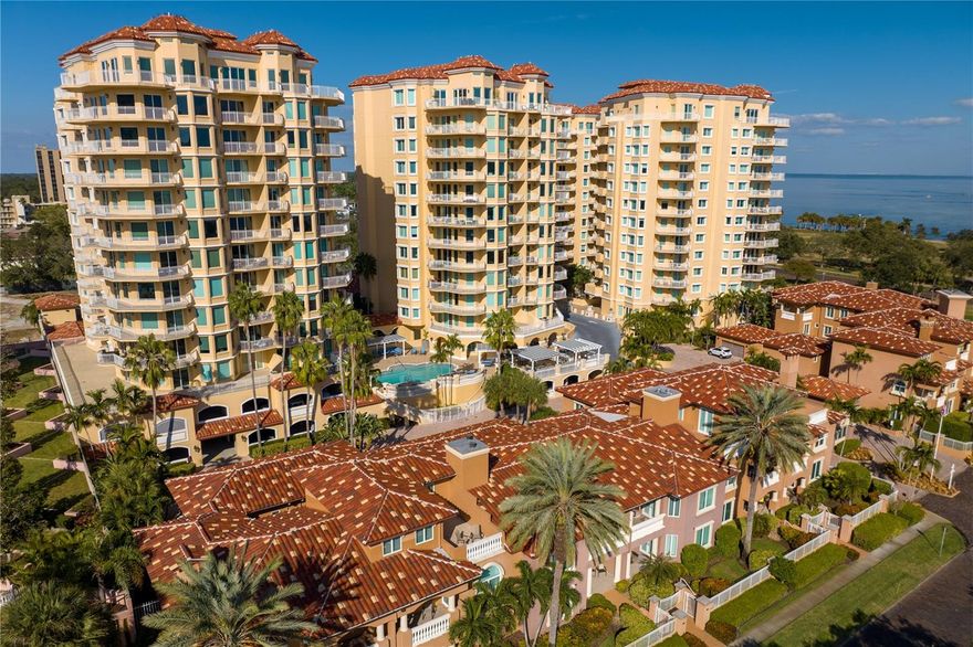 Luxury awaits! This majestic VINOY PLACE CONDOMINIUM will dazzle you with breathtaking views of the bay and its blue horizon, lush waterfront parks, the iconic Pier, and the remarkable St Petersburg skyline. Experience elegant living in this exquisite 3-bedroom, 2.5-bathroom condo prominently located in vibrant downtown St. Petersburg. This exceptional residence offers an unparalleled lifestyle with the comfort of a single-family home yet the excitement of city dwelling. The elevator lands at your private lobby featuring a custom wall treatment that charms, then leads to the stunning living space brimming with natural light.  Custom built-in cabinetry, dramatic pan ceilings, remote motorized window treatments and rich finishes all surrounded by glass doors framing the captivating views of the waterfront and downtown.  This homes 3,000 sq ft floor plan is a testament to modern understated elegance; seamlessly flowing from living space, dining, kitchen, and terrace areas. The renovated and timeless kitchen is equipped with high-end SS appliances, island, bar with ample storage, sleek granite countertops, custom entertaining bar with wine refrigeration; it's a culinary enthusiast's dream. The expansive living area is bathed in natural light, provides a perfect backdrop for relaxation and entertainment; with direct views of Tampa Bay, the dazzling "Bending Arc" billowing art sculpture installation at the iconic Pier. Each of the three bedrooms is designed with comfort and tranquility in mind, offering a serene retreat after a day exploring the city. The primary suite will delight!  It is a haven of luxury with an elegant bedroom; and its fully renovated spa-like bathroom featuring separate vanities, custom cabinetry, freestanding tub, glass frameless shower, quartz counters and a dazzling integration of glass, mirror, and quartz walls.  The substantial 11x12 custom design closet is a clothier’s dream. Bedrooms #2 and #3 are well appointed and share a fully renovated custom bathroom boasting dual vanities, quartz counters, backlite mirrors and frameless glass shower. Additional bonus space den or “Vinoy Room” serves as an extra family room and gathering place. Hurricane rated windows and doors, zoned HVAC systems, separate/dedicated laundry room, guest powder room and additional storage space add to this amazing property. Tremendous wraparound balconies encompass this trophy condominium, allowing seamless flow from inside to the open air. Prime location in the vibrant downtown of St. Petersburg with boutiques, fine dining, world renowned museums, entertainment, marina, and park all right outside your front door. This condo is not just a home; it's a lifestyle choice for those seeking sophisticated luxury, unparalleled comfort, and the very best of downtown St. Petersburg living. Vinoy Place Condominiums is a gated community with world class amenities.  24-hour security, concierge services, impressive fitness center, 2 pools & spas, renovated outdoor kitchen with stainless grills, multiple large community rooms including a full catering kitchen which can be reserved for your private events.  This condominium enjoys 2 parking spaces, one underbuilding garage space and one covered parking space. Truly one of the most remarkable condos the luminous St Petersburg has to offer.  Enjoy the virtual tour video of this fine property attached to this listing.