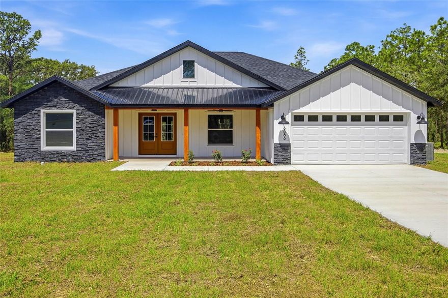 Welcome to this beautifully crafted farmhouse-style retreat situated on 1.14 fully cleared acres, offering the perfect blend of rustic charm and modern comfort. With 1,751 sq ft under air and 2,475 total sq ft, this home features inviting curb appeal with a spacious front porch and relaxing lanai, ideal for enjoying peaceful country living. Step inside to a warm farmhouse-inspired interior with rustic aesthetics throughout. The heart of the home is the expansive open-concept kitchen, thoughtfully designed for both functionality and entertaining. Enjoy upgraded wood cabinetry, a stylish farmhouse sink, upgraded appliances, built-in microwave conveniently located in the island, a hood vent for enhanced cooking ventilation, and a convenient pot filler above the stove. The spacious living area features a built-in electric fireplace beneath the entertainment center space, creating a cozy focal point for gatherings and relaxing evenings. The oversized primary suite offers a private retreat with a large walk-in closet thoughtfully located within the bathroom to maximize wall space in the bedroom. The luxurious primary bath also includes dual his-and-her sinks for added convenience and comfort.
With its open layout, upgraded finishes, charming farmhouse exterior, and generous cleared acreage, this property offers the perfect balance of style, space, and functionality.