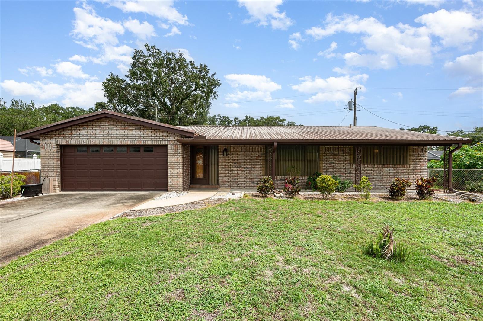 Situated on a quiet cul-de-sac, this well-maintained residence offers a blend of functionality, comfort, and peace of mind, all without the restrictions of an HOA. The home features a desirable SPLIT FLOOR PLAN and wood flooring throughout the main living areas, creating a warm and inviting atmosphere. A versatile FLEX ROOM or den provides additional living space and opens directly to a SCREENED IN PORCH, ideal for year-round outdoor enjoyment. The fully fenced backyard offers privacy and security, perfect for pets or recreation. Recent upgrades include NEW PLUMBING and NEW WATER HEATER, ensuring long-term efficiency. Hurricane shutters add an extra layer of protection during storm season. With a flexible layout and close to shopping, restaurants, and the highways, this home is perfectly suited for both everyday living and entertaining, all within a quiet, established neighborhood.