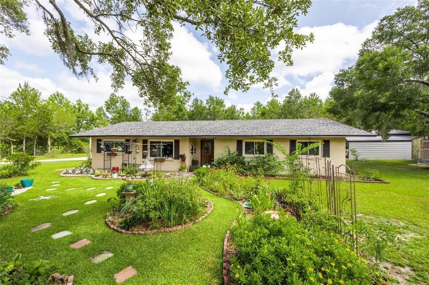 Discover comfort and convenience in this spacious 4-bedroom, 2-bathroom home situated on a generous 1-acre lot in the heart of Bronson. Built with durable concrete block construction, this home offers low maintenance and long-lasting quality. Step inside to find easy-to-clean tile flooring throughout and a welcoming layout perfect for families or entertaining. The kitchen is a standout feature with elegant wood cabinetry and beautiful stone countertops, providing both style and functionality.  NEW ROOF in 2021.  Outside, enjoy the Florida sunshine with an above-ground pool—ideal for cooling off during warm days. Need storage? This property includes both a shed and a 3-bay detached barn, giving you ample space for tools, equipment, or recreational gear. Located less than 20 minutes from Gainesville, you'll enjoy the peace of country living with all the conveniences of the city nearby. Don't miss out—call today for more information or to schedule a private showing!