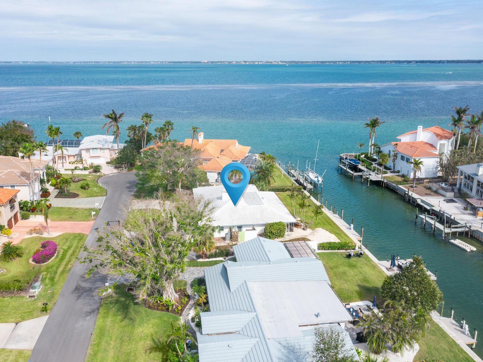 Great opportunity to refurbish per the FEMA plan for LBK or design & build your new Dream Home with the best water views being "1" in from Sarasota Bay. Bring serious buyers who love a project !! Revel in the breathtaking Sarasota Bay views. Following a complete remediation from storm Helene this property has been professionally prepared to be a cost-effective restoration. Additionally, the seller has architectural plans for a new build which will be conveyed with the property. This charming masonry home, rich in classic appeal, features two spacious dual owner's suites, a den/3rd bedroom with sliders opening to the patio, a large great room with a wood-burning fireplace, adjoining dining room, and an open kitchen. The expansive family room is adorned with walls of windows which boasts stunning water views over the private 110 feet of canal with a 2021 seawall and composite dock, including water and a power pedestal. This property offers quick access from your new dock to the intercoastal waterway, or the Gulf of Mexico - perfect for a day of fun boating or deep-water fishing. Relish the advantages of living in south Longboat Key, with all it has to offer including a resident only private deeded beach access, and reasonable HOA dues of $100.00 annually. The award-winning Resort at Longboat Key Club is right across the street and offers 45 holes of championship golf, tennis, pickleball, a spa and fitness center, and many dining options. The Resort hotel is super convenient for your guests who want to stay right on our beautiful sugar sand beach. Start living that easy bay to beach lifestyle today!