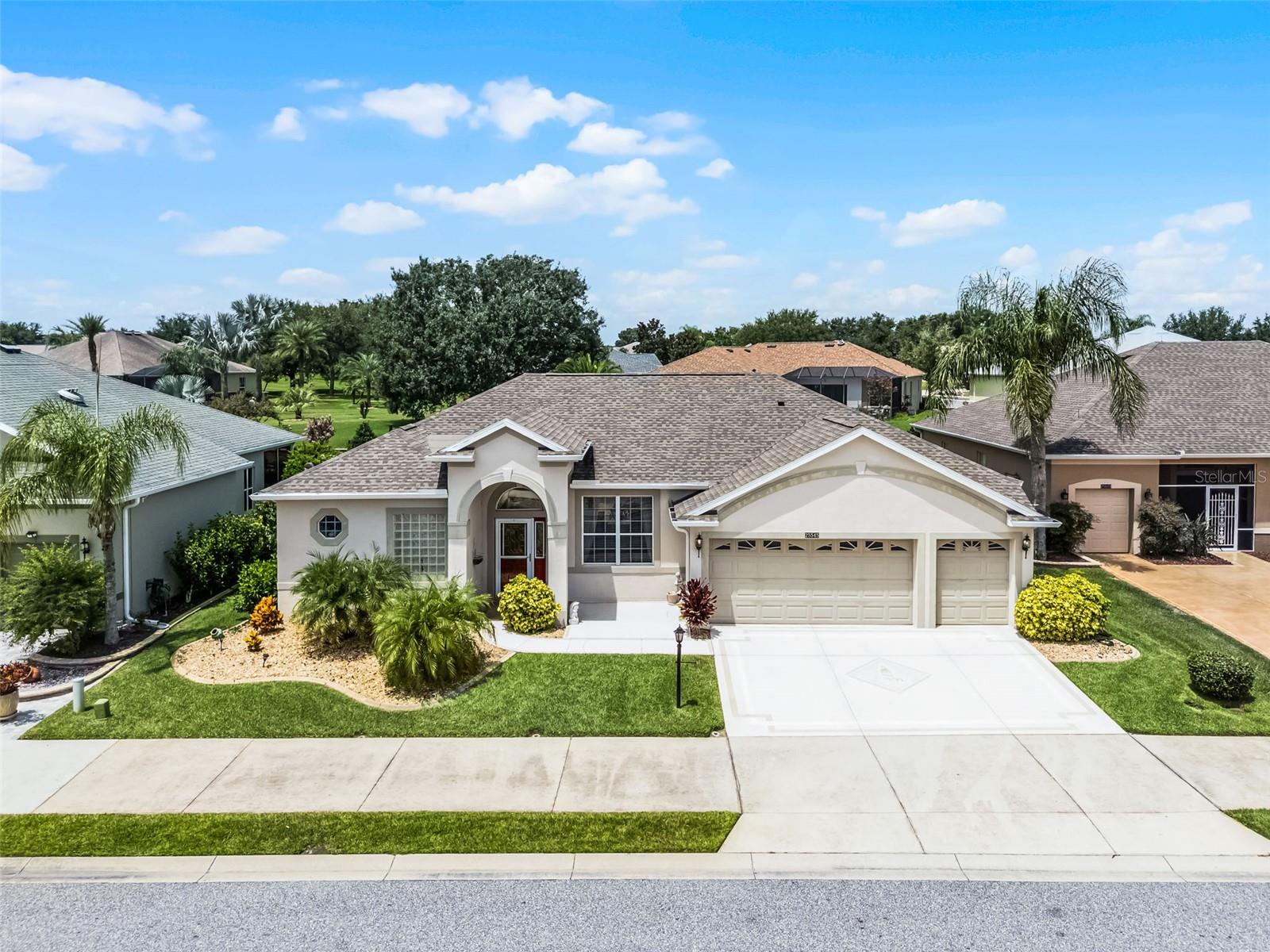 Step into the lifestyle you’ve been dreaming of in the vibrant 55+ community of Plantation at Leesburg, where resort-style living meets everyday comfort and elegance. This beautifully designed home offers nearly 2,400 sq. ft. of well-appointed living space, including a spacious layout perfect for both relaxing and entertaining. From the moment you walk in, you’ll notice the soaring ceilings, abundant natural light, and thoughtful details throughout. The chef-inspired kitchen is a standout, featuring Corian countertops, stainless steel appliances, 42” cabinets, a breakfast bar with pendant lighting, and an adjacent nook for casual meals. Host gatherings in the formal dining and living rooms or unwind in the inviting family room. Need extra space? A separate, closed-off room with french doors makes the perfect office, hobby space, or private den. The luxurious primary suite offers direct lanai access, en suite with double vanities, a jetted tub, and a walk-in shower. A split layout provides privacy for guests, with their own full bath and generous closet space. You’ll love spending time outdoors in the expansive screened lanai, ideal for your morning coffee or evening wine while enjoying peaceful Florida sunsets. Additional features include a 3-car garage with room for your golf cart, a (2020) water heater, and a new roof and HVAC system with UV light installed in (2022). Plantation at Leesburg offers unmatched amenities: 24/7 guard gate, multiple activity centers, three pools, two 18-hole golf courses, tennis, pickleball, bocce, billiards, archery, softball, arts and crafts, and a wide variety of clubs and social events. Plus, you're just minutes from shopping, dining, and medical facilities. Don’t miss your chance to own this exceptional home and embrace the ultimate 55+ lifestyle. Schedule your private showing today!