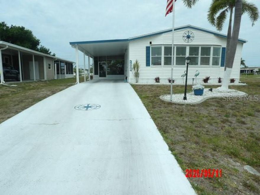 Welcome Home to an exceptional Canal Front residence perfectly positioned on an oversized Lot.  The Dock was recently renovated with Trek composite material.  Fish from your backyard.
Located in Holiday Mobile Estates 3rd Addition a sought after community where you Own your land by Fee Simple and Pay NO monthly Maintenance fees!  Enjoy peaceful Morning coffee or unforgetable sunsets with your new friends.
Pet Friendly and Golfcarts are a way of life here.
Now about The Home:
* There is a Living Room as Well as a Family Room or whatever you choose to do separated by Unique Arched Entrances.
* Well maintained with Repairs if needed.
* Kitchen offers ample Cabinets and Countertops along with a breakfast bar.
* Laminate flooring 
* CHA 2018
* Detached Shed along with a separate attached "Golf Cart" Shed.
* Uniques touches that you will see.
* Hurricane shutters on most windows and 3 straps on Carport.
Membership to the Edgewater Clubhouse transfers with Purchase.  The Cost is JUST $315. A Year.  It is not mandatory to be a member of the Clubhouse or Homeowners Association of $50. Annually is optional as well.
There are many amenities offered from Swimming, Pickle Ball, shuffleboard, tennis and other outdoor activities.
Inside The Clubhouse you are Welcomed with Dinner Dances, Themed Parties, Live Entertainment and More.  
The Dedicated Entertainment provides many events to enjoy.

The Gulf Beaches are about 15 minutes away.
There are also Public Golf Courses and Boat Ramps Nearby.
Some Furniture will not convey with Sale, but not much.
Sold-As-Is, Subject To Buyer's approval.
All information presented here is deemed reliable and to the best of our ability, but Buyer/Buyer's Agent should Verify.