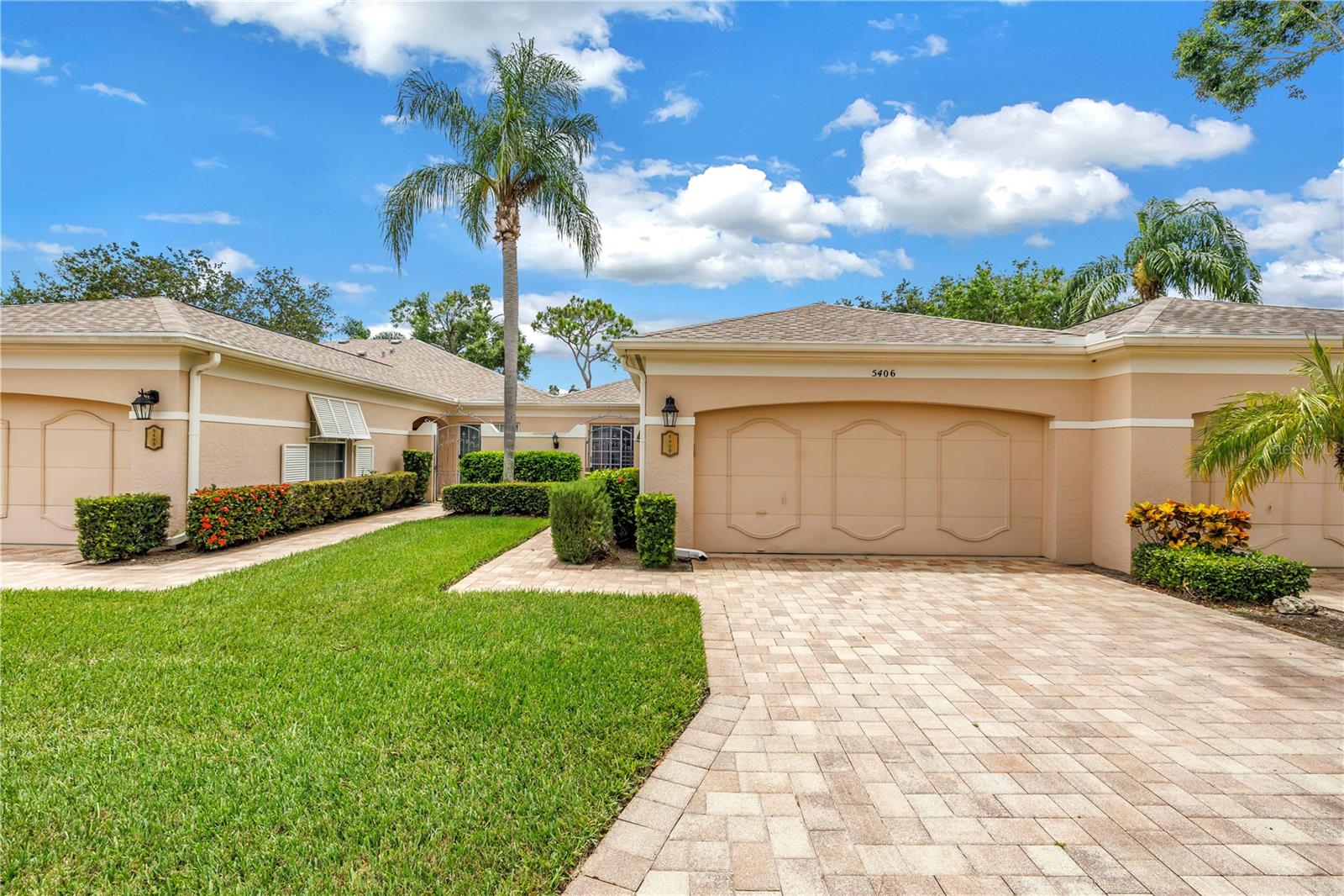 Welcome to effortless living in the highly coveted Chanteclaire enclave within The Meadows. This beautifully maintained villa offers timeless style, thoughtful upgrades, and a prime location just minutes from University Town Center, Lakewood Ranch, Benderson Park, and downtown Sarasota. Positioned along the fourteenth tee, the home provides tranquil golf course views and is only steps away from the community pool. A bright and open kitchen features stainless appliances, an inviting breakfast nook, ample cabinetry, and a serving window that opens to the dining room, making it perfect for both casual meals and entertaining. Recent improvements include a new HVAC system, water heater, and complete home repiping for added peace of mind. Elegant touches such as crown molding, plantation shutters, luxury vinyl flooring, recessed lighting with dimmers, and smooth ceilings bring refinement to the interior. The spacious garage includes shelving for extra storage, and the screened lanai is equipped with a motorized hurricane shutter for added protection and convenience. Residents of The Meadows enjoy access to more than 1,600 acres of open space, 85 picturesque lakes, and over 14 miles of walking and biking trails woven through a canopy of mature trees. Whether you are searching for a seasonal getaway or a permanent residence, this villa presents a rare opportunity to enjoy a carefree lifestyle in one of Sarasota’s most established communities.