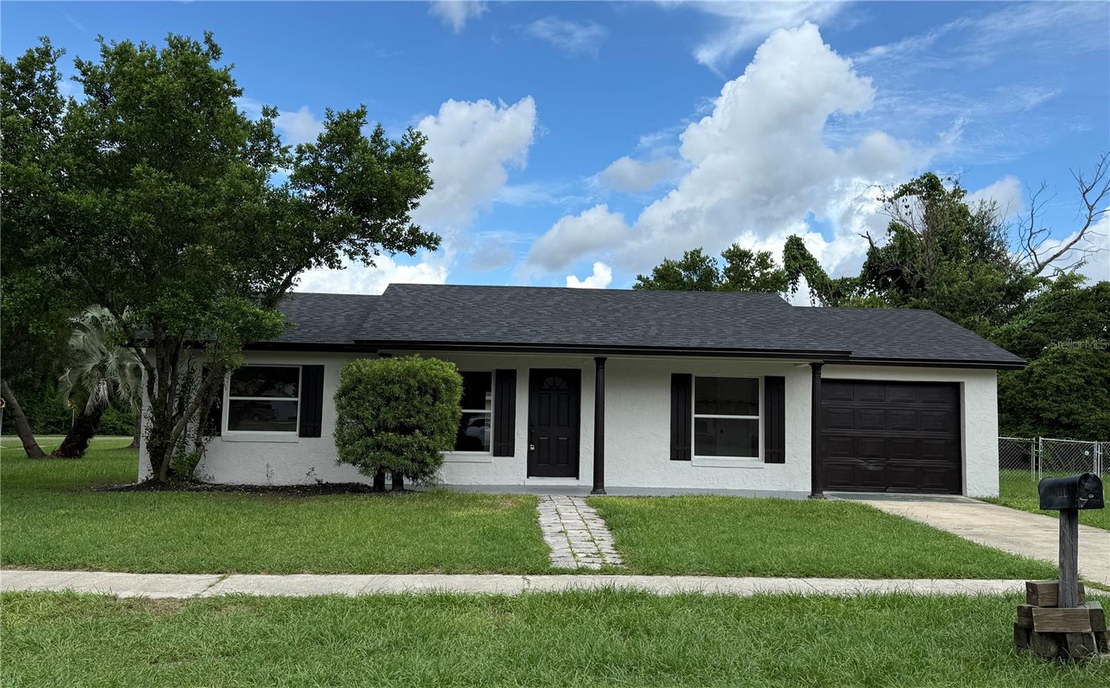 One or more photo(s) has been virtually staged. Beautifully remodeled 3-bedroom 2 bath block home located on a spacious corner lot in desirable Casselberry! This move-in-ready home features a New 2025 Shingle Roof, brand-new kitchen, updated bathrooms including a hall bath with tub and a private master bath with a walk-in shower. Enjoy peace of mind with modern finishes throughout. The enclosed garage offers flexible use as covered parking and bonus space. Outside, you'll find a large fully fenced yard with low-maintenance aluminum fencing-perfect for pets or entertaining. Relax in the screen enclosed rear patio and enjoy Florida living at its best. Don't miss this opportunity-schedule your showing today!!!