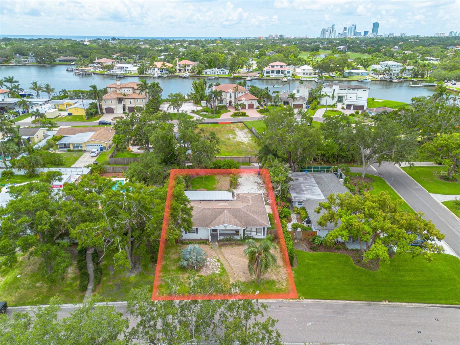 Build your dream home in Crisp Park on this oversized 65 x 127 lot, offering endless possibilities in one of St. Petersburg’s most desirable neighborhoods. Start fresh with new construction, this property is a rare opportunity in a prime location. The fully fenced backyard includes alley access and a rear driveway, providing privacy and off-street parking. Just steps from Crisp Park with its waterfront picnic areas, playground, and public boat ramp, this property also offers walkability to Publix, Trader Joe’s, Fresh Market, and Whole Foods. Enjoy easy access to downtown St. Pete, the Pier, waterfront parks, museums, and some of the area’s top dining. Whether you're a builder, investor, or future homeowner, this is your chance to create something special in a truly sought-after community. Call today to explore possible elevations and plans for new construction.