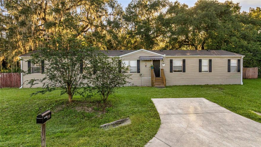 Beautiful 1 acre property in Deer Meadows! No HOA or Lot fees. Located on a quiet, paved cul-de-sac street. Offers privacy while only a few miles from Hwy 301 for easy commute to Ocala or Gainesville. Property backs up to a large 20 acre agricultural parcel, no rear neighbors. This spacious home has 4 bedrooms, 2 baths and 2,057 living sq ft. Open floorplan offers a large living room / family room combo and large dining room plus eat in kitchen and interior laundry. Primary bedroom has large ensuite with 6x12 walk in closet. Double wide was built in 2002 with recent updates including: 5 Ton 14 Seer HVAC in 2024 with new ducts and wiring, water softener replaced 2022, commercial grade vinyl flooring, subfloor replaced on side with 3 guest bedrooms, new lighting, septic last pumped in Dec 2021, Roof last replaced in 2010. Large property with majority fenced. Take a look at everything this peaceful property has to offer in a convenient Citra location.