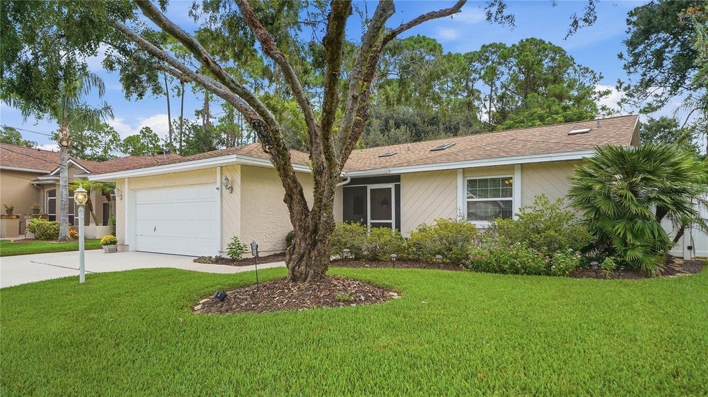 Photo of 12 Woodford Lane, Palm Coast, FL 32164 (MLS # FC321063)