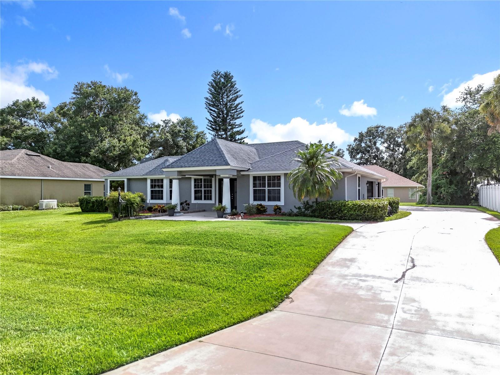 3-bed, 2-bath POOL home, NO HOA!!! and a rare 3-car side-entry garage, all situated on a spacious ¼-acre lot. Step inside to discover 1,422 square feet of comfortable living space featuring a desirable split floor plan. The primary suite includes an en-suite bath with dual vanities, a relaxing garden tub, private water closet, and newly updated flooring in both the bedroom and closets. Two additional guest rooms and a full bath are tucked away on the opposite side of the home, offering privacy for family or visitors. The open eat-in kitchen overlooks the sparkling screened-in pool, perfect for entertaining or enjoying Florida’s sunny weather. Other highlights include fresh interior and exterior paint, a new water heater, the AC was installed in 2019 and a roof in 2017. The inside laundry room adds convenience, while the 3rd garage bay—previously used as interior space with French doors—offers flexibility for a home gym, office, or workshop. Located just minutes from Eustis, Tavares, and Mount Dora, you’ll have easy access to shopping, dining, and recreation. Plus, you're only a short drive to the Harris Chain of Lakes—home to some of the best bass fishing in Central Florida. Don’t miss this opportunity, call today to schedule your private tour!