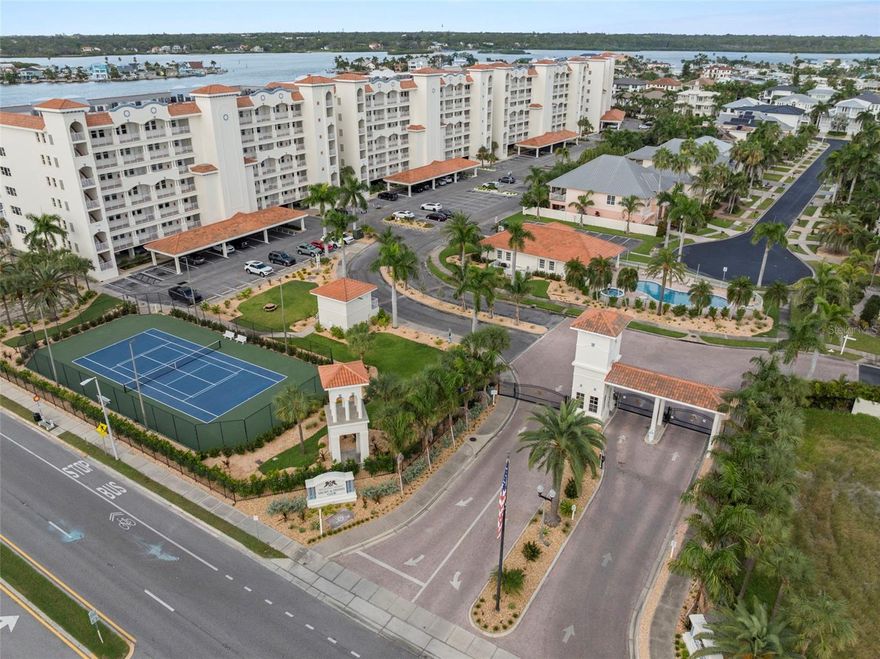 Welcome to Las Palmas at Redington Shores Yacht & Tennis Club—an exclusive, resort-style gated community perfectly situated between the Intracoastal Waterway and the Gulf of America. Just steps from the pristine sands of Redington Shores Beach, this coveted address offers the best of both worlds: serene waterfront living with sweeping Intracoastal views and breathtaking sunsets over the Gulf.

Perched on the third floor, this spacious 3-bedroom, 3-bathroom residence spans nearly 2,000 square feet of coastal living, complemented by an expansive balcony where you can savor gentle breezes, golden sunsets, and tranquil views of Boca Ciega Bay. With northern exposure off the back balcony and warm southern light from the front, this home is bathed in natural Florida sunshine from sunrise to sunset.

Designed as an investor’s dream and a rare blank canvas, the split-bedroom layout offers endless potential. Two guest suites feature walk-in closets, ensuite baths, and southern views, while the primary retreat delivers waterfront vistas, two walk-in closets, and a spa-like bathroom with a soaking tub and walk-in shower. The open kitchen area provides the space and flexibility to be reimagined into a true chef’s paradise, perfect for entertaining after a day at the beach.

Life at Redington Shores Yacht & Country Club feels like living in a private seaside village. Behind the 24-hour guarded gates, residents enjoy wide sidewalks shaded by tropical landscaping, four boutique-style condominium buildings, and an array of resort amenities. Each building includes its own lobby and elevator, a heated pool and spa, grilling station, outdoor shower, and peaceful waterfront backdrop. The community also features two lighted tennis courts, a kayak launch, a dog run, and a newly reimagined clubhouse on the way, with completion expected in 2026. The redesigned clubhouse will feature a welcoming lounge, full kitchen and entertaining spaces, a state-of-the-art fitness center, and a community pool and spa—all designed to elevate the coastal lifestyle.

Adding to the value, this unit includes **a private poolside cabana**—perfect for storing beach gear, entertaining, or enjoying shade by the water—and **one dedicated parking space**, with generous guest parking available for visitors. HOA services further enhance peace of mind by covering cable, internet, water, sewer, trash, exterior maintenance, building insurance, and dock lighting.

Best of all, you’re directly across from Redington Shores Beach, with private gated beach access and easy reach of waterfront dining, boutique shops, and charming Gulf Coast beach bars. With flexible 30-day rentals permitted, this property is as attractive to investors as it is to full-time residents or seasonal snowbirds.

Bring your vision, embrace the possibilities, and create your dream coastal retreat in one of Florida’s most sought-after waterfront communities.