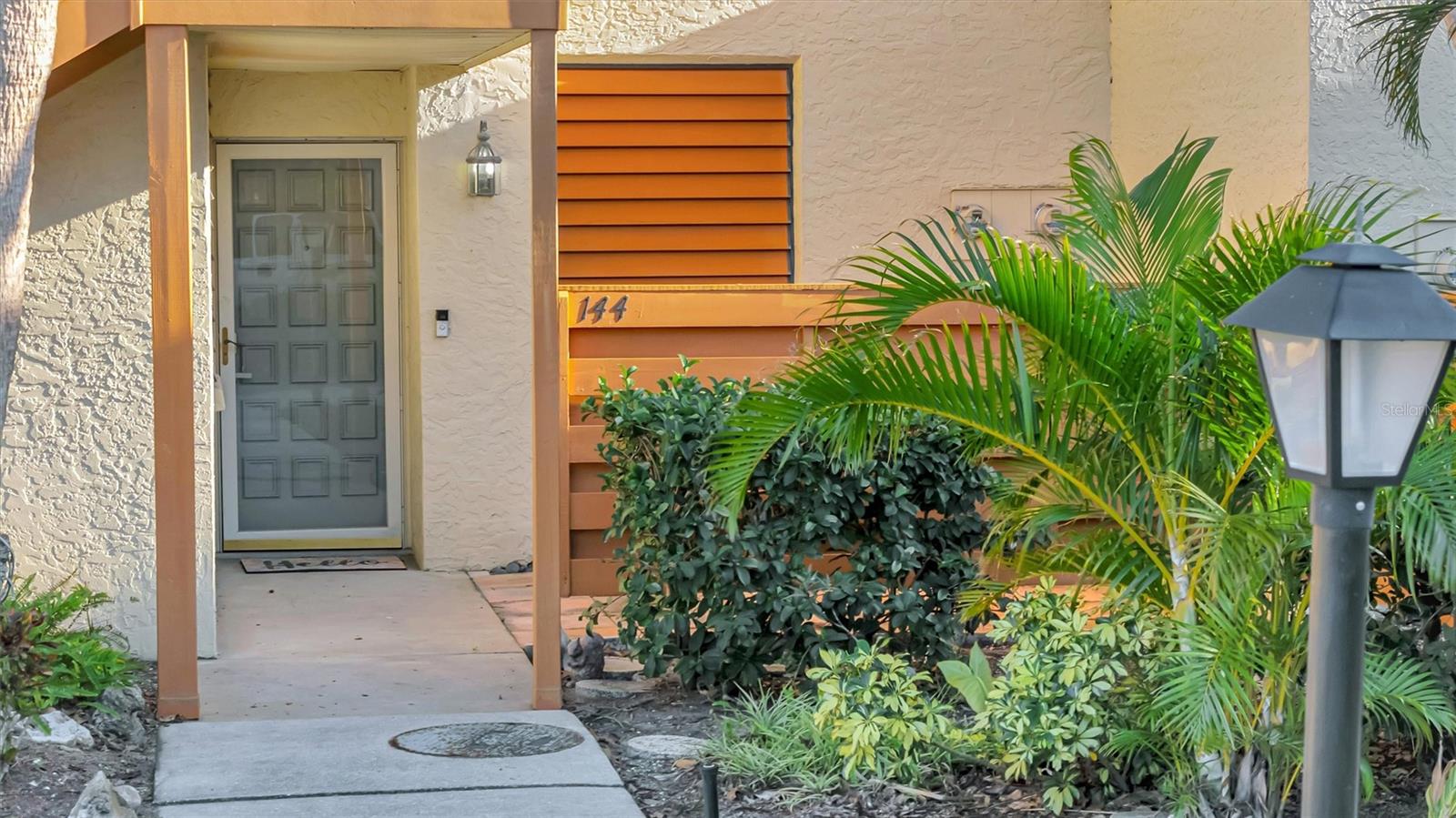 MAJOR PRICE REDUCTION!! Welcome to Paradise at Wildewood Springs! This charming 2-bedroom, 2-bathroom condo in the highly desirable Wildewood Springs community is ready to impress! Move-in ready with thoughtful upgrades, it features a new HVAC system (2024), a convenient in-unit washer and dryer (2024), and renovated guest bathroom (2024). The kitchen boasts new ceramic tile, while the living areas shine with luxury vinyl flooring, blending style and comfort. Experience the ultimate in Florida living with a large storage closet offering plenty of space for all your essentials, and a spacious screened lanai perfect for relaxing or entertaining. The sizable master bedroom provides a peaceful retreat with stunning views of the serene wooded backyard, making it the perfect spot to start and end your day. You’ll also appreciate the convenience of your coveted covered parking space. Living in Wildewood Springs means more than just a home—it’s a lifestyle. The community offers two sparkling pools, tennis courts, and is an official wildlife and bird sanctuary, proudly recognized by the Florida Audubon Society. Ideally located, this condo is just 6 miles from the pristine beaches of Anna Maria Island, 1 mile from the world-renowned IMG Academy, and 7 miles to SRQ International Airport. Whether you’re looking for a year-round residence or the perfect seasonal retreat, this condo delivers comfort, convenience, and a serene slice of paradise. Don’t miss this opportunity—schedule your private tour today and make this tropical haven your own!