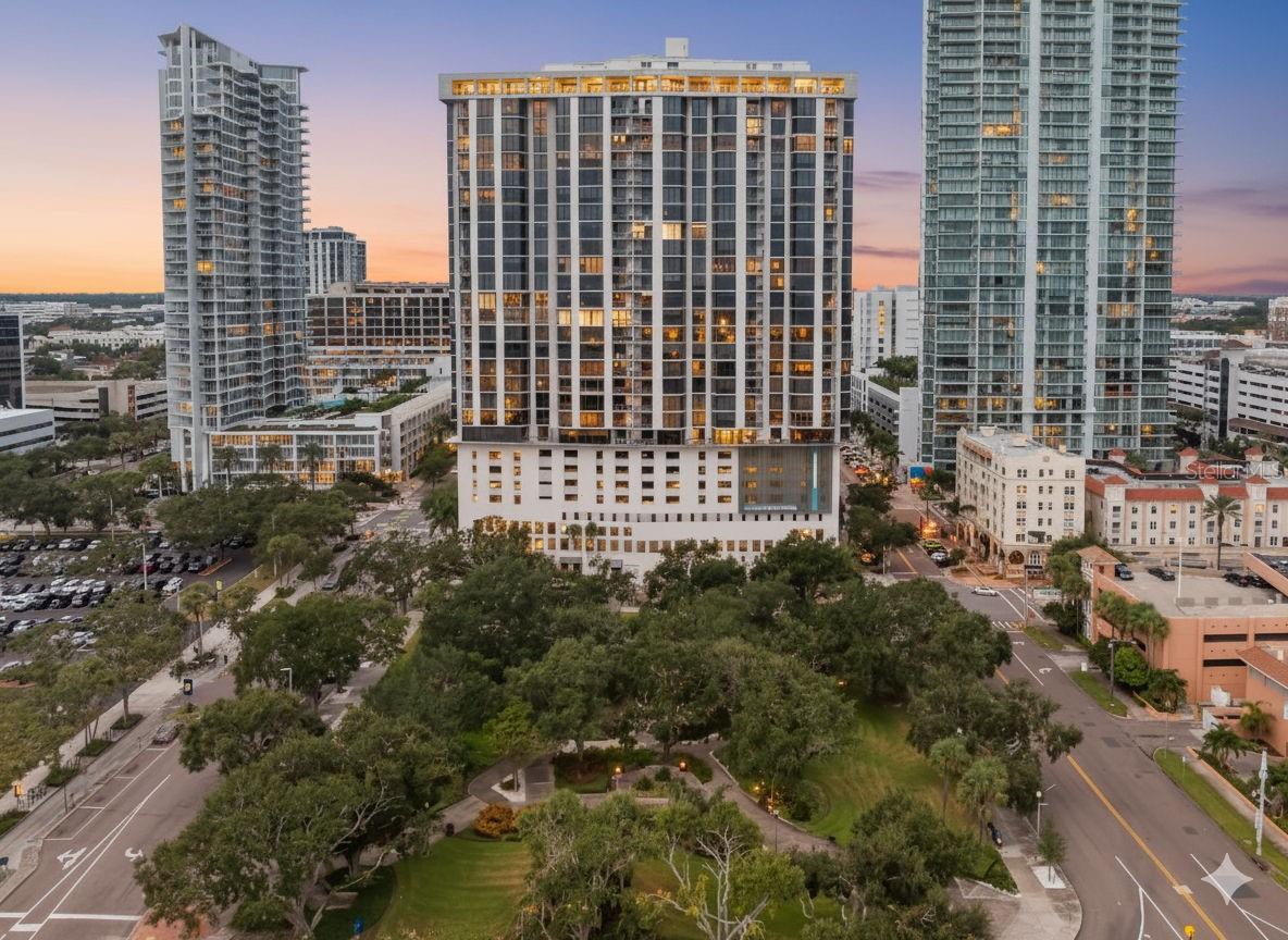 Experience waterfront luxury in this extraordinary two bedroom, two bath, 2,200sqft residence in the heart of Downtown St Petersburg. With 61 feet of sweeping floor-to-ceiling windows, this home offers unobstructed views of Tampa Bay, capturing breathtaking sunrises by day and sparkling city lights by night. Every detail has been meticulously curated in a custom-designed remodel, creating a seamless split floor plan with timeless elegance. The kitchen is open to a dining area and showcases a convenient island, granite countertops, and stainless steel appliances, with a breathtaking water view as the backdrop. The den shares the same spectacular views and is a versatile room, ideal for a home office, home gym, or entertaining space. The living area is spacious and includes a balcony, the perfect place to enjoy a cup of coffee or a glass of wine, watch boats come and go at the marina, and have a front row seat to fireworks over the bay. Classic crown molding paired with gleaming parquet flooring adds layers of sophistication, while abundant closet and storage space ensure both style and function. The primary suite is a private retreat, with a full wall of windows, room for a seating area, and a large walk-in closet. The en suite spa-inspired bath features double vanities, custom copper basin sinks, and a large walk-in shower. The guest bath, accessible from both the den and guest bedroom, includes a deep soaking tub. Additional convenient features include an interior laundry room off of the kitchen and a climate controlled storage unit. At Bayfront Tower, residents enjoy unparalleled amenities including 24/7 valet parking and concierge, a newly renovated 28th-floor social level, state-of-the-art fitness center, sauna, game room, extensive library, rooftop pool, walking track, gas grills, and more. Enjoy living in the heart of it all, just steps from endless restaurants to explore, sporting events and entertainment, world class arts and culture, a stunning new pier, vibrant nightlife, and all of the benefits of waterfront living without the responsibility. Step into a lifestyle of elegance and ease, this is waterfront living at its finest in vibrant downtown St. Petersburg.