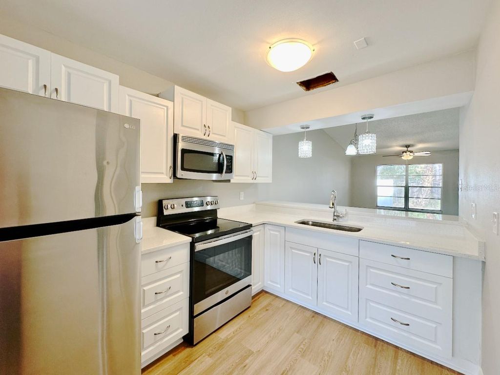 Photo of 7135 Parkside Villas Drive N, St Petersburg, FL 33709 (MLS # TB8451330)