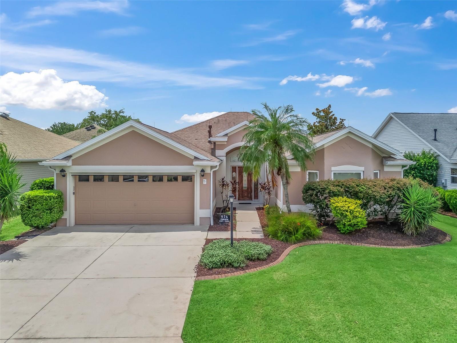Turnkey Designer Home, Walk to Sumter Square With many Upgrades & Move-In Ready!
Welcome to this beautifully upgraded 3-bedroom, 2-bathroom home with 2,044 sq ft of living space in the highly desirable Virginia Trace neighborhood—just a short walk to Lake Sumter Landing and steps from the Virginia Trace family pool and recreation center.
This home comes fully turnkey—tastefully furnished and move-in ready with modern updates, quality finishes, and exceptional care throughout. The kitchen features under cabinet lighting and pantry with available sitting at the high-top counters. The Living room features a fireplace, and you can open up the sliders to an open-air Lania. Step outside to your own outdoor kitchen, perfect for entertaining, that creates a versatile space for relaxing or hosting guests. Spacious primary ensuite with Dual sinks, water closet and updated beautiful shower. Guest bedrooms are very spacious with closet and the guest bathroom is updated with a tub/shower combo. Features include inside laundry with extra storage along with a 2-car garage with private screen and hurricane-rated garage door. Roof 2020 with lighting rods & A/C 2021 Windows 2024. Low Bond Balance. The mature landscaping excellent curb appeal.
Whether you're looking for a seasonal retreat or a full-time residence, this home has it all—location, upgrades, and move-in-ready comfort.