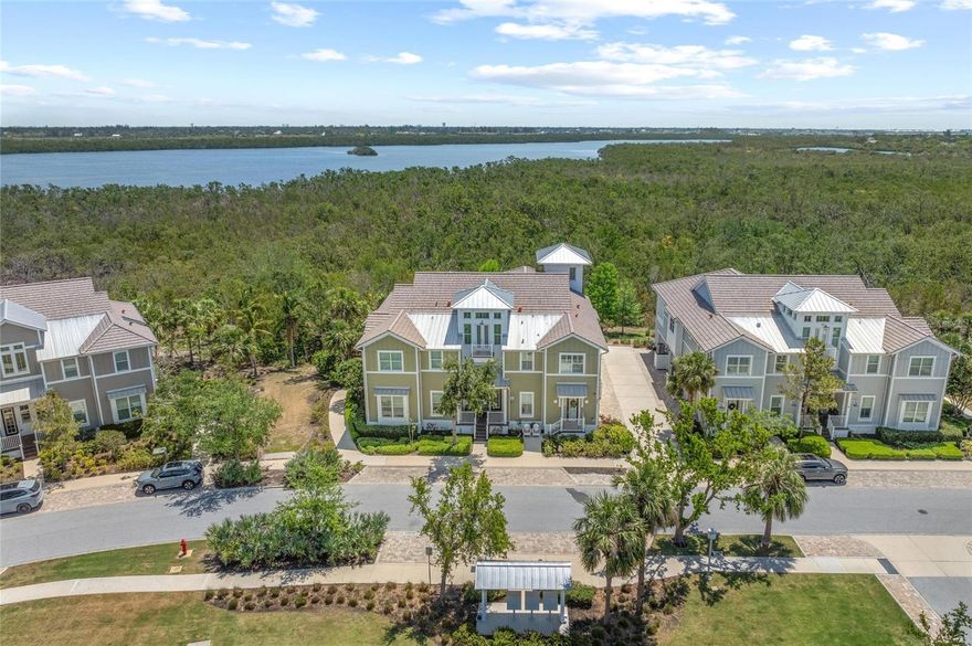 Turnkey Coastal Retreat with Private Elevator & Observatory. Perfect as a full-time residence or lock-and-leave winter getaway! This is what you have been looking for! Welcome home to this easy, breezy coastal living, 2159 square foot, Andros Grand home! Now you can live like you’re on vacation in the beautiful gated coastal resort community of Harbour Isle on Anna Maria Sound. In this luxury 3 bedroom, 3 bath home you can begin your mornings with a cup of coffee in your sunroom as the sun is rising over the mangroves and all the wildlife is awakening. This home is perfection and is strong and built-to-last! Immaculate, light and bright condo with design upgrades throughout — including updated light fixtures, Plantation shutters and blinds, wood-look luxury vinyl flooring, custom woodwork on walls and ceilings, crown molding, vaulted ceiling in living room, 8 ft. solid core doors, quartzite in kitchen and bath, refreshed paint, Coastal Decor, French doors, a private elevator that opens directly from your garage to your living space on the second floor, and so much more. In the kitchen enjoy stainless steel appliances including a double oven, 42” white wood cabinets, quartzite large island, counters and backsplash. The Owner’s retreat features a large bath with dual vanities, oversized stand alone shower and custom closet. The guest bedroom has an en-
suite full bath, allowing privacy for your guests. The home also features a third spacious bedroom/den/office. The third full bath is large and conveniently located in the hallway and easily accessible from the main living area. A bright sunroom, large living area and dining room
are also included on the main level. A third level observatory is perfect for a relaxing get-away or office where you experience great views of Robinson Preserve and glimpses of peaceful water. The HVAC is Newer and the warranty extends complete coverage through August 8, 2033. The large 2-car garage has 12’ ceilings that allow for overhead storage. The home is in an area with a spacious green lawn for enjoying the sunshine located directly out your front door. The building has block construction with Hardie board exterior siding and PGT impact rated windows. The FURNITURE is included! A must see!  Harbour Isle is second to none. While in the gates explore two miles of walking trails and inviting hammocks. There are four neighborhood pools for your enjoyment with grills, cabanas, fire pit, lap pool and kayak launch to use in the Sound or the 38 acre Sapphire Lake. Don’t miss the incredible sunsets from the 23,000 square foot Beach Club overlooking Anna Maria Sound. It features resort-style amenities including the Sky Bar, Lounge, Pavilion, Fitness Center, Yoga Lawn, resort pool, hot tub and private beach. Outside the gates of Harbour Isle walk to Margaritaville inspired Compass Hotel, Safe Harbor Marina and Floridays waterfront tiki restaurant. Just cross the Manatee Bridge and you’re on charming Anna Maria Island with its sugar sand beaches and over 30 restaurants/shops for your enjoyment. Robinson Preserve, where wildlife and trails abound, is less than two miles away. Don’t miss this one! For video, copy and paste: youtu.be/ncHkr22bK2A  It’s time to start living your best life in this gorgeous home located in award-winning Harbour Isle.