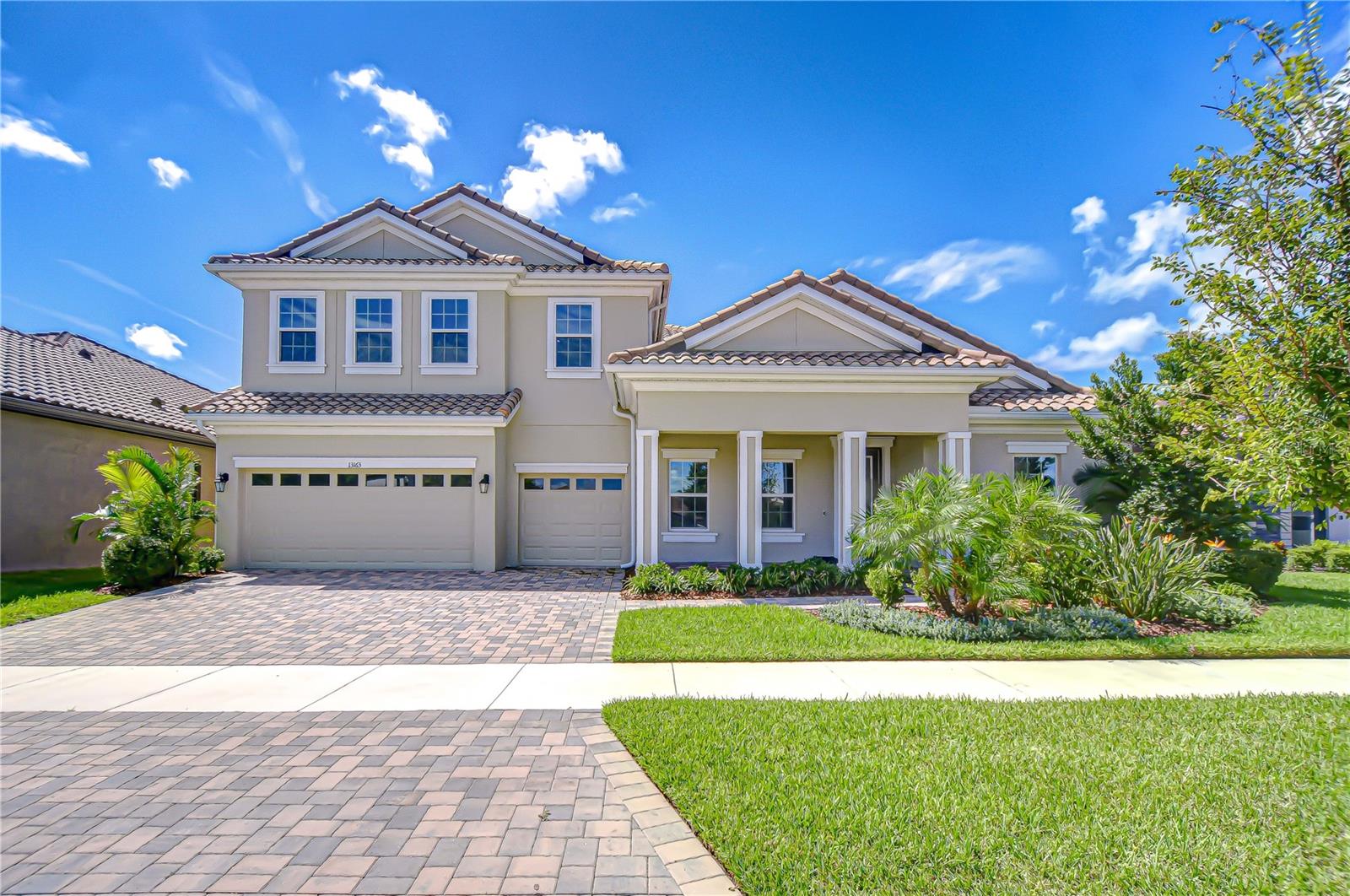 Step into a world of refined luxury in Hawkstone, where this stunning West Bay Key West II home sets a new standard for modern Florida living. Designed for both elegance and comfort, this 5-bedroom, 4-bathroom residence features a dedicated home office, an expansive bonus room, and a thoughtfully planned triple-split layout that ensures privacy and flexibility for family and guests alike. Inside, soaring ceilings, tray and crown molding, wide baseboards, and sophisticated wood-look tile flooring create a light-filled, elegant atmosphere. The home office, framed by French doors, offers a serene retreat, while the open-concept great room flows effortlessly into the gourmet kitchen. Here, a large center island, premium stone countertops, top-of-the-line stainless appliances, soft-close cabinetry, and a walk-in pantry make both everyday living and entertaining effortless. The primary suite is a true sanctuary, with double-door entry, a spa-inspired en-suite featuring a luxurious walk-in shower, and an oversized walk-in closet. Two secondary bedrooms share a bath downstairs, while two additional bedrooms upstairs share a bath, complemented by the enormous bonus room—perfect for media, gaming, or a home gym. Step outside to your resort-style backyard retreat, complete with a saltwater heated pool and spa with sun shelf, a pavered screened lanai, fenced yard, and lush tropical landscaping—all with complete privacy and no backyard neighbors. Every detail has been thoughtfully upgraded, including a new fence and gutters, epoxy garage flooring, recessed and ambient lighting, smart home switches, a high-SEER upstairs AC with additional zone, water softener, whole-house surge protection, and permanent holiday lighting. Hawkstone offers miles of scenic walking trails and resort-caliber amenities, including swimming pools, a lap pool, pickleball and bocce courts, a dog park, playgrounds, a yoga lawn, and a floating dock. Located near top-rated schools, nature preserves, and family-friendly activities, with easy access to US-301 and I-75, this exceptional home delivers a rare combination of luxury, lifestyle, and ultimate privacy. Copy and paste the link to tour the home virtually: my.matterport.com/show/?m=DiBjFuYTepE&mls=1