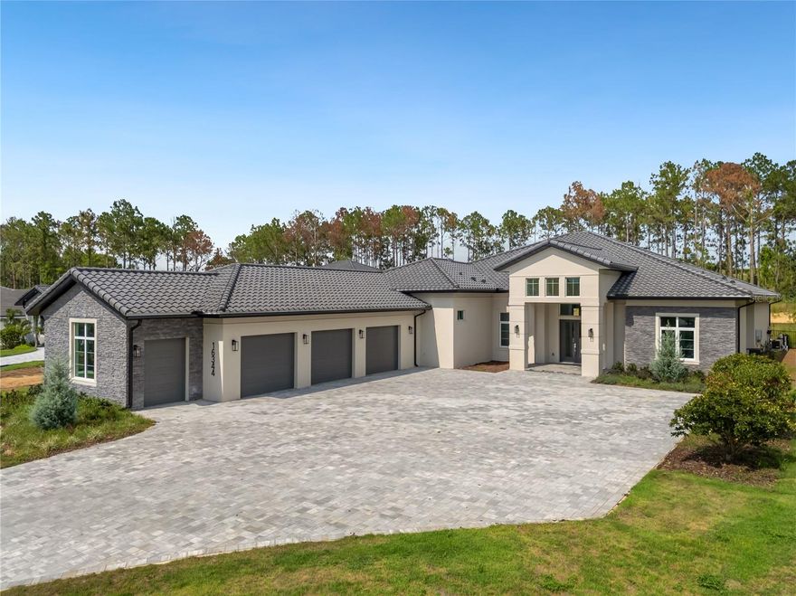 Located in the 24 hour guard gated community of Bella Collina, this contemporary single story custom home will be ready to move in May 2024. In addition to the 4 bedrooms with en-suite bathrooms and dedicated office, there is a large bonus/family room with double pocket sliding doors opening to the lanai with remote controlled screens, outdoor kitchen and pool area on a private one acre site. The open kitchen plan with gas range features Fisher & Paykel appliances overlooking the great room with high ceilings and plenty of light. The primary bedroom opens the lanai and offers a large double entry walk in closet. Master bath has an oversized walk in shower, free standing tub and custom double vanities. The club at Bella Collina offers plenty of amenities with social and culinary events year round. Enjoy a spa day, a round of golf, or join your neighbors for tennis or game of pickleball. The club offers 24 hour access to the fitness center and training studio with free fitness classes. Enjoy lunch at the outdoor pool complex, or meet up at one the restaurant terraces overlooking the rolling hills. All homeowners have access to the community boat ramp on Lake Siena. Just 15 minutes to downtown Winter Garden and 1.5 miles to Montverde Academy. Call today to preview this home and learn more about the Bella Collina lifestyle.