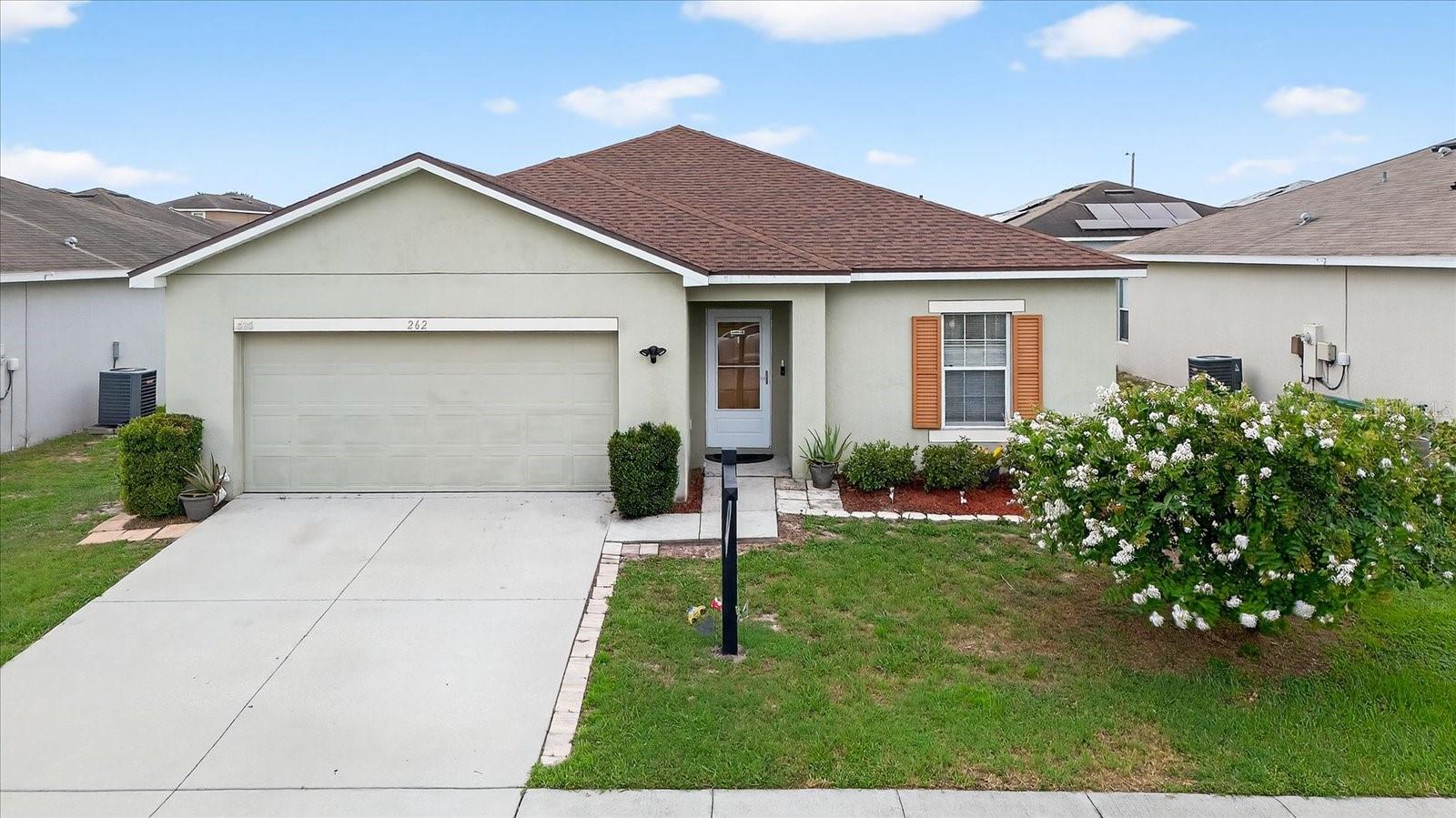 One or more photo(s) has been virtually staged. WHY is THIS HOUSE better than new construction? Because it's time for an exterior paint refresh! SO the SELLER IS OFFERING BUYER A FULL PAINT PACKAGE! Interior and exterior paint done before closing or after, their choice, and BUYER GETS TO PIC THEIR OWN COLORS! A list of HOA approved (exterior) color selections is attached AND the buyer gets to pic all their own interior colors!! PLUS this house comes with an AMERICA'S PREFFERED HOME WARRANTY! With this warranty, if you ever need to use it, you can use contractors of their own choosing! PLUS this home has beautiful, NEW waterproof high end, luxury vinyl plank flooring in the main living areas, and brand new fresh carpeting in the bedrooms. The wet areas have ceramic tile. New roof was installed 2024! A lovely wide hallway greets you when you enter. FOUR generously sized bedrooms, with an open floor plan in the living room/Island kitchen with walk in pantry, and nice sized dining area will give you the room you need. The Floor plan is included in the photos. The home is 8 years young and situated in the Lakes at Lucerne which is a quiet well kept community where the children are still playing together outside and neighbors are friendly! Come grab this opportunity while it lasts!