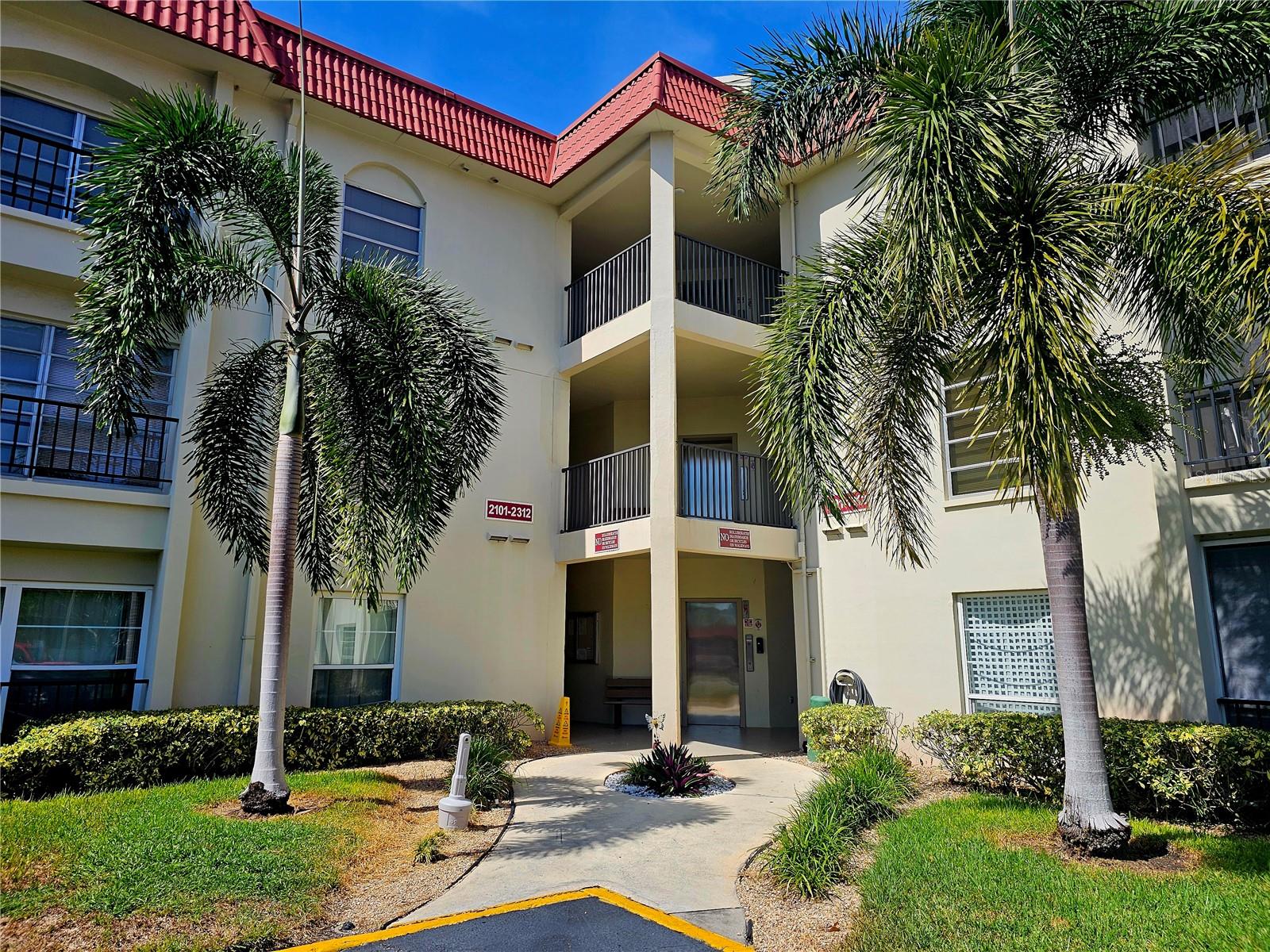 You will not find a cuter condo under $250k on the west coast of Florida! Model-like home featuring luxury vinyl plank flooring, quartz countertops with waterfall, coastal backsplash, stainless steel appliances, built in coffee/wine bar, custom cabinetry/trim, built in desk/office, updated bathrooms and fresh paint. Mediterranean Manors is a coastal retreat that has it all! Private beach, waterfront park with direct access to The Gulf, kayak launch, boat mooring, heated pool, clubhouse, tennis, pickleball, bocci, shuffleboard, fitness center, game room and library. The community has completed all Milestone Inspections, SIRS, and repair requirements. All assessments have been paid in full. NEW roof in 2025 and this unit comes with a covered carport and storage closet under carport. Building 2 is the ONLY building that allows rentals immediately with no waiting after closing. Across the street from Pinellas Bike Trail, and only a few short blocks to Dunedin Causeway, Dunedin Golf Club, marinas, Publix and restaurants! 2nd Floor unit with elevator so no worrying of flooding.