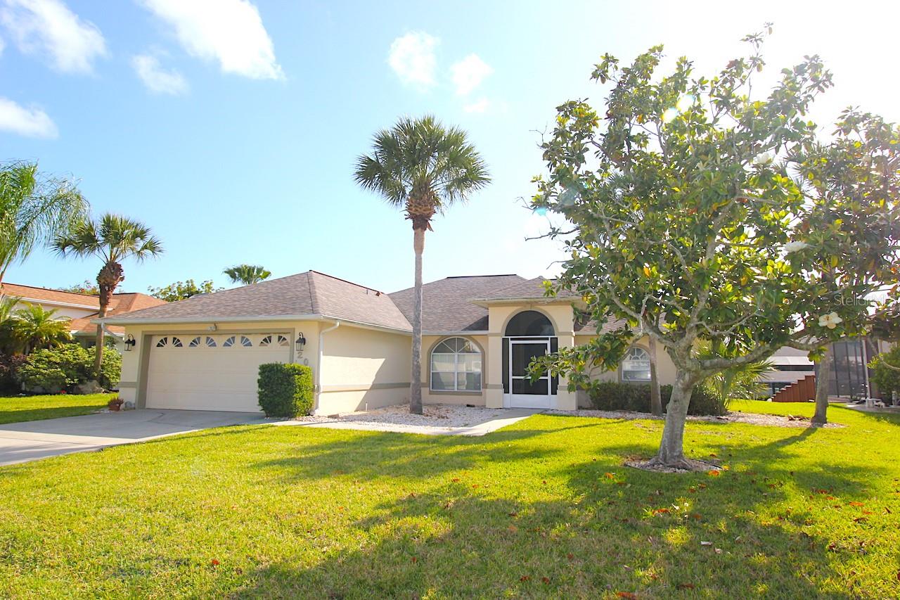 Gorgeous 3 bedroom 2 bath 2 car garage home with BOAT DOCK on a navigable salt water canal in the highly sought C Section. This amazing home features a spacious floor plan with an open living and a formal dining area. The kitchen sports modern stainless appliances and features nook area overlooking the huge screened lanai. The primary bedroom offers a double closet set up and a beautifully remodeled bathroom with a tub and walk in shower. Cleanup is easy with tile in the main areas and lvp flooring in the bedrooms. The spacious covered lanai offers ample room for relaxing and entertaining and overlooks the navigable salt water canal and dock area, offering the sail boat country feel. Inquire about it today! LBTR#13922