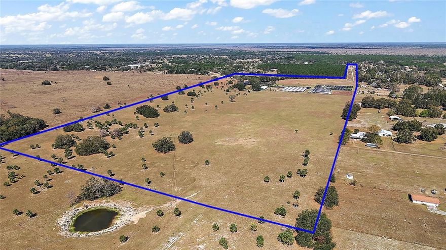 Vast and open land in Eustis.Gross acreage approximately 68 Acres. The property is located in Lake County’s jurisdiction.  Specifically in Northeast Lake County.  It consists of three adjoining parcels. Lake County Parcel ID numbers:  04 19 28 0002 000 05600 (Alternate Key 3792273), 04 19 28 0002 000 00400 (Alternate Key 1710961), and 33 18 28 0003 04300. The property is currently zoned Residential; however, the land has agricultural status. Water Source: Five 4” wells on site.  6” mainline irrigation for approximately 8 acres of plant production. There is a Septic Tank for office bathrooms. Buildings: 60’ X 120’ Metal building with reception area, 3 large offices with 1 private bathroom. 2 separate employees’ bathrooms with 3 stalls and 1 shower each. A large break room and exterior stairs leading to storage above office building, 1 Concrete block storage building, 2 framed storage buildings, and under roof parking bays. OTHER STRUCTURES: 180’ X 180’ Deep Shade Greenhouse Structure 2 180” X 100’ Shade Structures. Nursery acreage (10-12 Acres) is fenced, cross fenced gated and front gate entry locks. Cows are grazing on the back parcel.