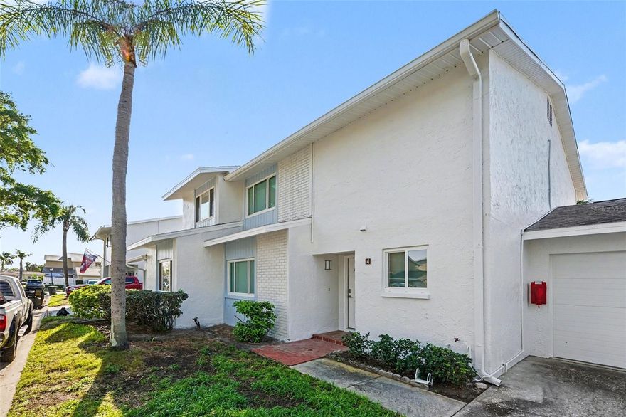 One or more photo(s) has been virtually staged. Welcome to this spacious 4-bedroom, 3-bathroom condominium in the established Mariner's Pass community. Offering 1,610 sq. ft. of living space, this home features modern luxury vinyl flooring and a neutral palette throughout. The open layout includes a bright kitchen with a full appliance package. This unit is a rare find with a 1-car attached garage and is situated within a lush, 4.85-acre waterfront community. Located in NE St. Petersburg, you are just 0.2 miles from Shore Acres Elementary and minutes from downtown. Mariner's Pass offers a community pool and waterfront access, providing a perfect blend of convenience and Florida lifestyle. Schedule your showing today!