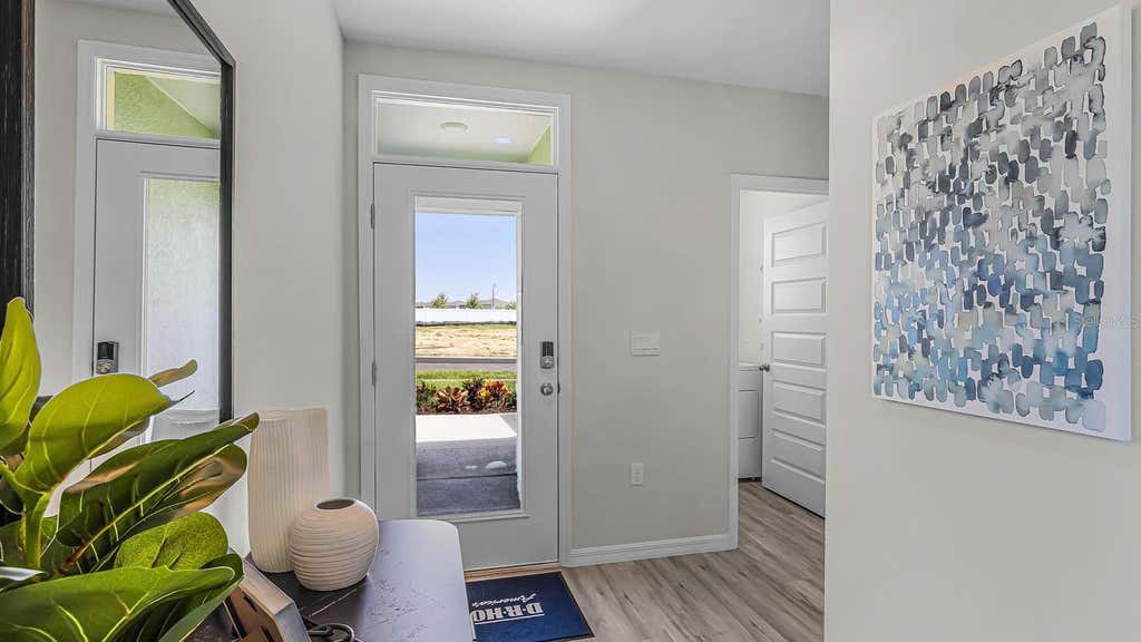 Photo of 5584 Taverna Loop, Winter Haven, FL 33884 (MLS # O6428729)