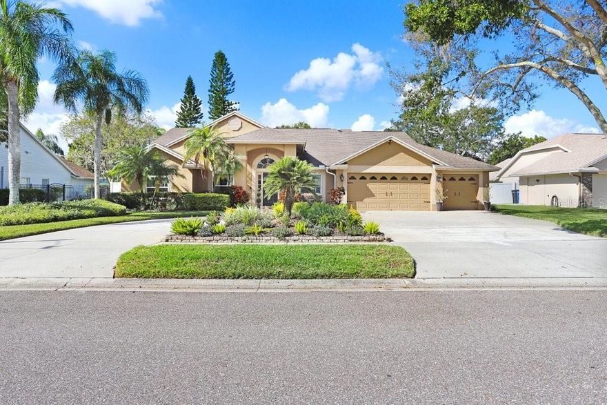 Rare, beautifully appointed home in the sought-after Trails at VanDyke Farms community, this 4-bedroom, 3-bathroom pool home offers the luxury and convenience you desire. Sitting on a 16,000 sq ft lot, arrive via a circular driveway that leads to a 3-car garage. Upon entering, you'll immediately see the endless entertaining possibilities. The home features an open floor plan that allows you to customize your own at-home office, formal dining room, formal living room, or all three! Well-designed with a split floor plan, this home's primary bedroom is a true retreat, offering privacy and comfort, with high ceilings and wide sliding glass doors that provide private access to the heated, screened-in saltwater pool. The luxurious primary bath is a dream, featuring a spacious walk-in closet, granite countertops, dual vanities, a walk-in shower, and a soaking tub to meet all your needs. The interior features an open floor plan, high ceilings, and abundant natural light. Double sliding glass doors with pool views from all rooms. Travertine, tile, and hardwood flooring seamlessly connect each space. As you enter the foyer, you'll be welcomed into elegant dining and living areas overlooking the pool. Relax at day's end with a drink from the built-in bar and unwind by the wood-burning fireplace with a newly rebuilt chimney. The updated kitchen, equipped with modern stainless-steel appliances, provides ample counter space, an island with seating, a pantry, and a finished laundry room with custom cabinets. The thoughtfully designed split floor plan ensures privacy and peaceful separation of bedrooms. The secondary bedrooms are nearby and share a bathroom with dual sinks. The final bedroom has its own space in the home, including a bathroom, making it ideal for guests. The backyard is a Floridian's dream, featuring a screened lanai, heated saltwater pool, and new vinyl fencing, offering endless possibilities to create your perfect paradise. Plenty of room to add an outdoor kitchen or tiki bar! Situated on a large lot, there's ample space for outdoor enjoyment and future landscaping, easily maintained with the digital irrigation system. Pool Heater ($4000 value), HVAC System (2021), Pool pump system (2024). Community life at Van Dyke Farms is vibrant and full of opportunities. Residents enjoy abundant green space and high-quality amenities, including multiple sports courts for tennis, pickleball, and basketball, an exercise trail, a clubhouse, and a playground. Nature lovers will appreciate the conservation areas and shimmering lakes with a fishing dock and gazebos, perfect for relaxed walks and outdoor fun. Van Dyke Farms is in one of Tampa Bay's top A-rated school districts (Hammond, Martinez, and Steinbrenner), with quick access to Veterans Hwy & Suncoast Parkway, as well as close proximity to the airport, shopping centers, and entertainment venues. This home offers easy commutes, blending tranquility with connectivity. Don’t miss your chance to experience Florida living at its best. Schedule a viewing to see your new home today!