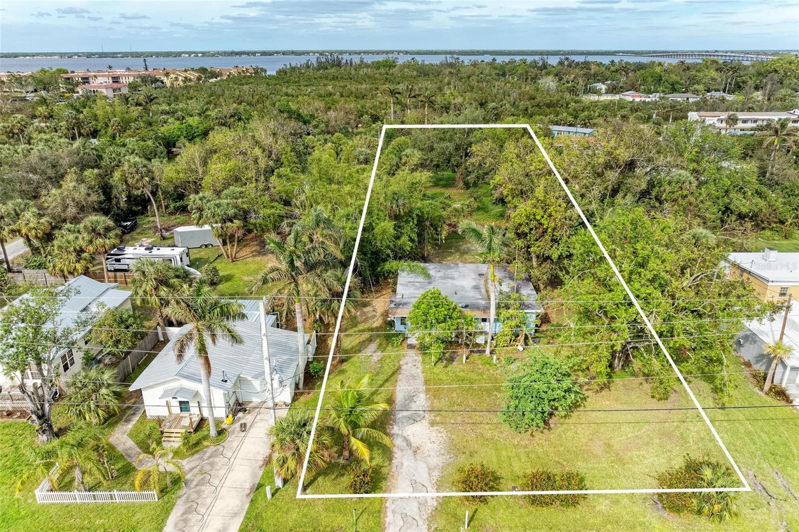 PRICE REDUCTION! Check out all the possibilities for this property! This 1.7-acre parcel offers significant potential for development, with the possibility of subdividing into four lots. One lot is zoned for commercial/residential use, strategically positioned facing Marion Avenue, other 3 lots can be multi-family residences. While the property has experienced major flood damage and is deemed irreparable, it presents numerous opportunities for investment in a prime location near the heart of Punta Gorda. Located in a thriving community, this property offers the perfect opportunity to bring your vision to life. Whether you’re dreaming of a custom-built home, a rental property, or a multi-use development, this lot’s size and location make it a standout choice.
Prospective buyers are encouraged to consult Charlotte County zoning regulations to explore the myriad possibilities for commercial ventures. The site is in proximity to notable attractions such as Fisherman’s Village and offers convenient access to highways 75 and 41, as well as the new Sunseeker Resort at Charlotte Harbor. This expansive piece of land represents a unique opportunity to create a customized vision in a desirable area. Don’t let this opportunity pass you by—rarely does a lot with so much potential become available in such a great area. Contact us today and take the first step toward turning your dream into reality! RESIDENTIAL LISTING A4629954.