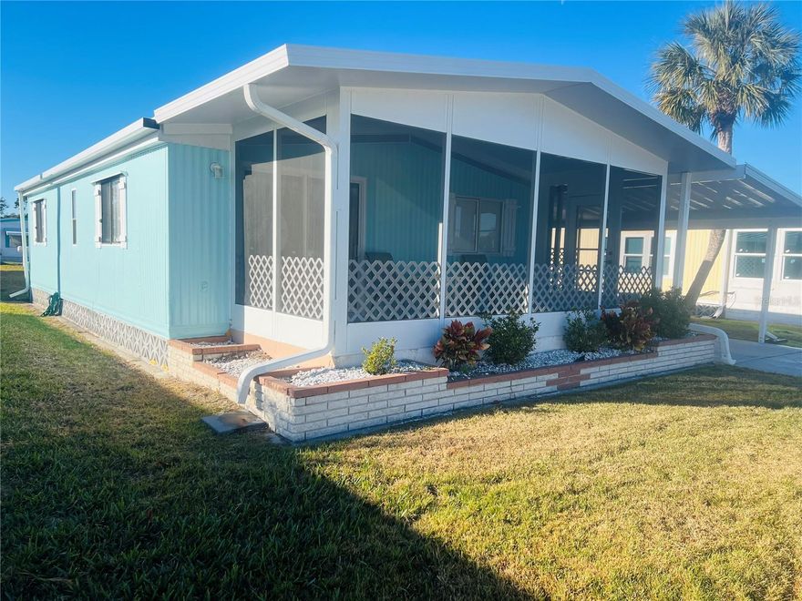Welcome back to the market! This charming fully furnished double-wide manufactured home boasts a beautiful, fresh coastal update. The bright kitchen features a new refrigerator and is equipped to meet all your needs for stylish living. The master bedroom comfortably accommodates a king-size bed. Situated in the desirable Venetian Park Estates, this property offers access to a vibrant over-55 community. Residents can enjoy a large, heated community pool and spa, shuffleboard courts, weekly and annual events, engaging game nights, and other amenities. The property includes a newly constructed carport and lanai. This home is move-in ready!