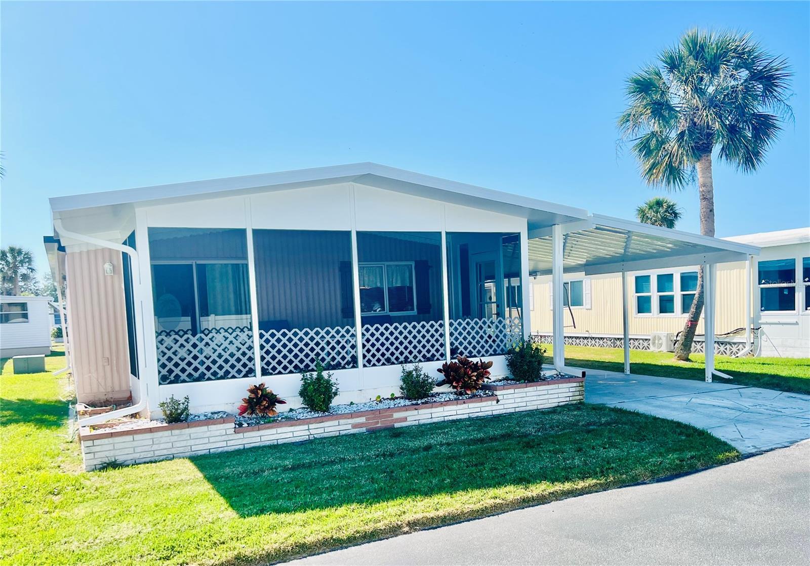 Charming double wide manufactured home, in highly sought after Venetian Park Estates. Very active over 55 community features, a large community heated pool and spa, shuffleboard, annual events, game nights and so much more. New carport and lanai. Complete with everything you need to move in!