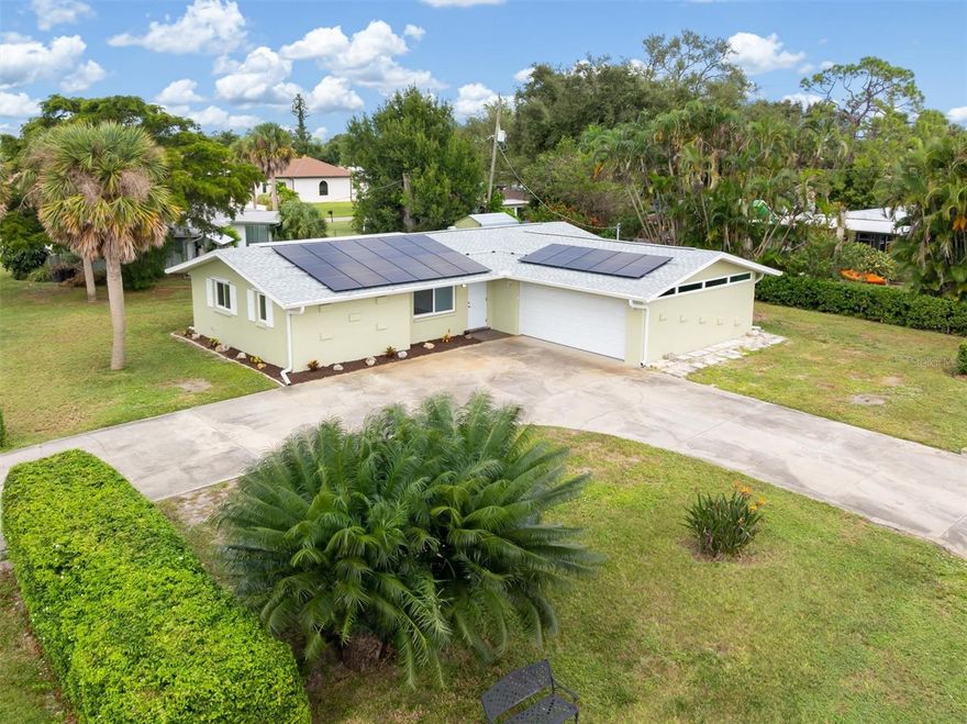 One or more photo(s) has been virtually staged. Welcome to this updated 2-bedroom, 2-bath home with a 2-car garage located on a corner lot in South Venice, surrounded by mature palms and tropical landscaping. No HOA, no CDD fees, and located in an X flood zone.

Seller will pay off the solar system at closing, allowing the next owner to benefit from low electric costs without assuming a solar loan.

Major improvements have already been completed, including a new roof (2022), HVAC (2022), hurricane-impact windows (2021), water heater (2024), and solar panels installed in 2022, contributing to an average electric bill of approximately $45 per month.

Inside, the home features a freshly painted interior in soft coastal tones and new flooring throughout. The kitchen has been updated with quartz countertops, stainless-steel appliances, soft-close cabinetry, and modern finishes, opening to a bright living space suitable for both everyday living and entertaining.

The primary bedroom includes a walk-in closet and private en-suite bathroom, while the guest bedroom and second full bathroom provide flexible space for visitors, a home office, or additional living needs. Updated lighting and modern outlets with built-in safety features are found throughout the home.

The screened lanai offers a comfortable outdoor space with shade and privacy from mature trees. A detached storage shed provides additional storage for tools, beach gear, or hobby items.

Located approximately one mile from optional access to the South Venice Beach Ferry and private boat ramp, and just minutes from Manasota Key Beach, Venice Beach, Downtown Venice, parks, trails, and nearby kayak launches.

Some photos have been virtually staged to illustrate potential room layout and design.

Schedule your private showing today!