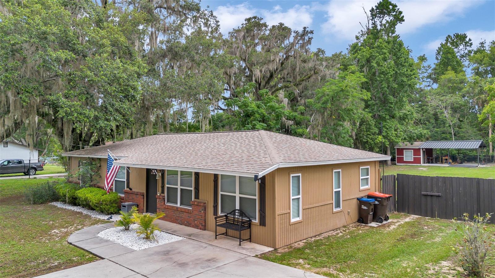 Discover this beautifully updated 3-bedroom, 1-bathroom home, perfectly nestled between Ocala and The Villages for an easy commute across Marion County. Situated within city limits on a spacious third-of-an-acre lot, this property offers plenty of room to enjoy the Florida sunshine in a large backyard ideal for a pool, garden, or outdoor activities. Relax or entertain on the enclosed tiled patio or the additional screened-in patio. The home boasts modern updates, including a new roof from 2020, freshly painted interior and exterior, newer stainless steel kitchen appliances, updated cabinets, and a modernized bathroom with a new vanity and fixtures. A backyard storage building provides both indoor and open-air storage with space for a workbench. Move-in ready and brimming with charm, this Belleview gem is close to shopping, dining, parks, schools, and medical facilities, offering the perfect blend of comfort, convenience, and Florida living. Schedule a showing today to make this home yours!