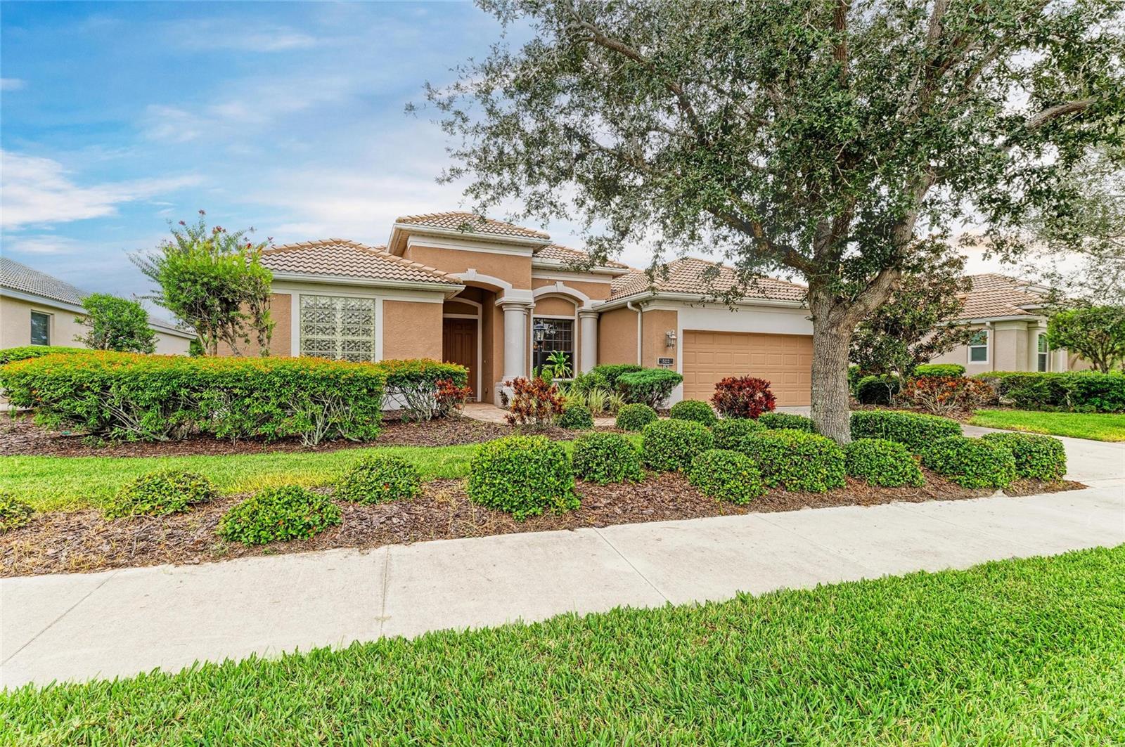 This highly sought-after Ashley II model is situated with southern exposure on the community lake within the beautiful Willowbend neighborhood. The residence encompasses 2,320 square feet of open living space, including three bedrooms, three bathrooms, formal living and dining rooms, and an additional office or den. The kitchen is equipped with a full island, generous cabinetry, breakfast bar, built-in desk, and abundant storage, seamlessly connecting to the great room that includes both a family area and dinette. Sliding glass doors provide access to the screened rear lanai. The split floor plan ensures privacy, positioning the master suite separately from secondary bedrooms. The master suite features two walk-in closets, a spacious bath with dual sinks, walk-in shower, soaker tub, and a dedicated toilet room. A sitting area affords direct access to the lanai and koi pond, with views across the backyard lake and local wildlife. The office, located at the rear of the home, offers an ideal work environment overlooking the lake. Interior details include high tray ceilings and crown molding. The screened lanai provides full views of the lake, while the laundry room offers a utility sink and ample storage. The monthly maintenance fee of $410 entitles residents to amenities such as a heated pool and spa, clubhouse, fitness center, pickleball courts, and a playground. Services include cable, internet, lawn care, mowing, trimming, sprinklers, and irrigation. Willowbend is ideally positioned between Sarasota and Venice, granting convenient access to renowned beaches like Siesta Key and Venice Beach, the Legacy Trail, diverse dining options from fine dining to tiki bars on the water, and extensive shopping opportunities. This home's location features Pine View School and lies in desirable Flood Zone X. Schedule your showing today!