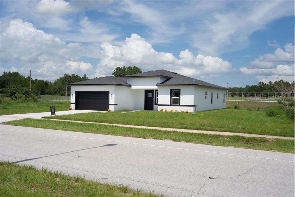 Photo of 105 Marion Oaks Course, Ocala, FL 34473 (MLS # O6325964)