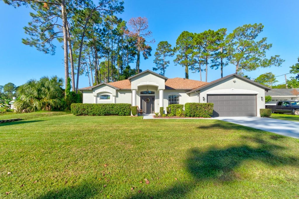 Photo of 37 Woodlyn Lane, Palm Coast, FL 32164 (MLS # FC321817)