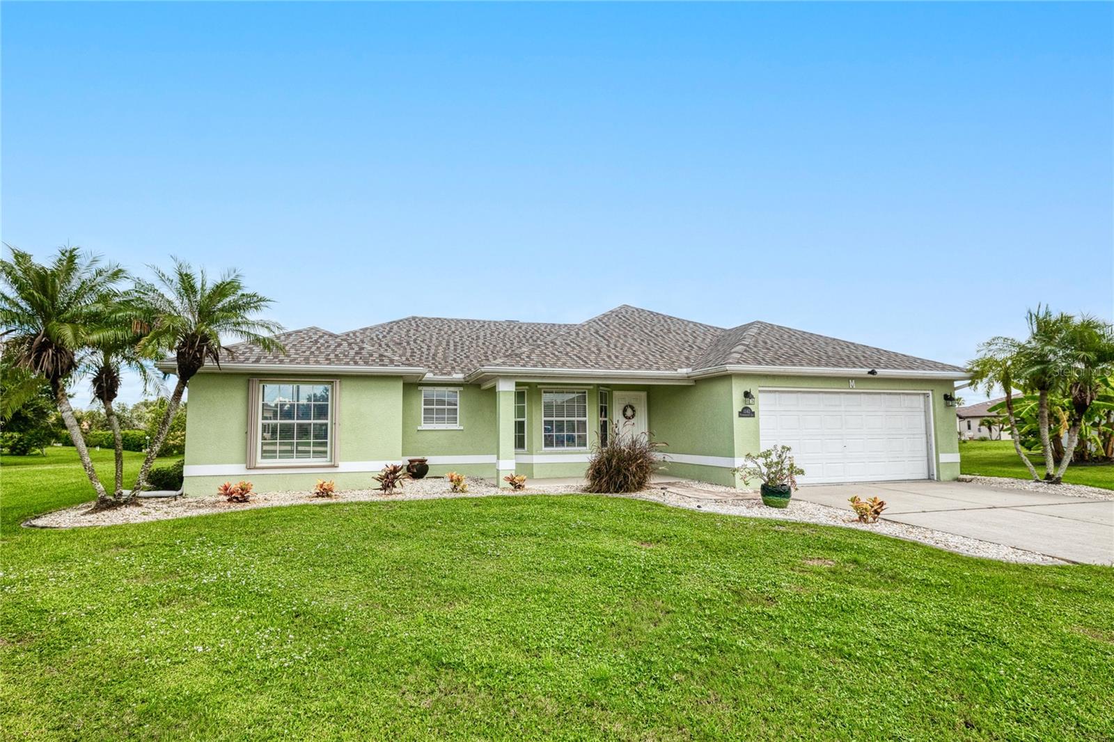 Welcome to this charming well maintained 3-bedroom, 2-bathroom home located on a peaceful, low-traffic cul-de-sac in the desirable Deep Creek community. Recent updates include a 2022 roof, 2019 hot water heater, and 2025 Rain gutters. You'll find vaulted ceilings, an indoor laundry room, and a LARGE YEAR-ROUND LANAI that provides a tranquil retreat overlooking the spacious corner yard. Situated in an X FLOOD zone (no flood insurance required). The home and the Lanai is equipped with ACCORDION HURRICANE SHUTTERS, giving you peace of mind in both security and value. Enjoy nearby amenities such as the Deep Creek Golf Course, Charlotte County Park, shopping, and convenient access to the best fishing and boating on the Peace River and Harbour Heights. Thanks to its prime location, you’ll also be just a short drive to lively downtown Punta Gorda, the SunSeeker Resort, and the stunning Gulf beaches of Englewood, Boca Grande, Venice, Sanibel, and beyond—don’t miss your chance to make this home yours today!