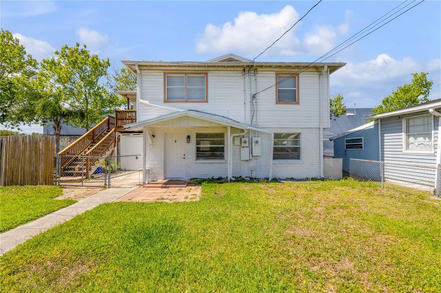 Calling all investors—this is a rare opportunity in Daytona Beach with serious income potential. Situated on a single parcel, this unique property features three separate living spaces, offering flexibility for rental income, multi-generational living, or a combination of both. The main structure is configured as a duplex, with both the first and second floors offering well-laid-out 2-bedroom, 1-bathroom units. Each level has been thoughtfully updated, including refreshed kitchens with newer appliances, modern finishes, and upgraded systems. In addition, a separate 1-bedroom, 1-bathroom mobile home sits on the property, complete with its own septic, electric, and water hookups—ideal for independent occupancy. The property has seen extensive improvements, including a new seamless metal roof, updated split-unit A/C systems for both levels of the duplex, a new well pump and tank, and a whole-property water filtration and softener system. A French drain has also been installed to enhance drainage. Located just minutes from everyday conveniences like Walmart, Publix, coffee shops, and dining, and just a couple miles from the Halifax River and the shores of Daytona, this property offers location, versatility, and strong income potential all in one. Mortgage savings may be available for buyers of this listing.