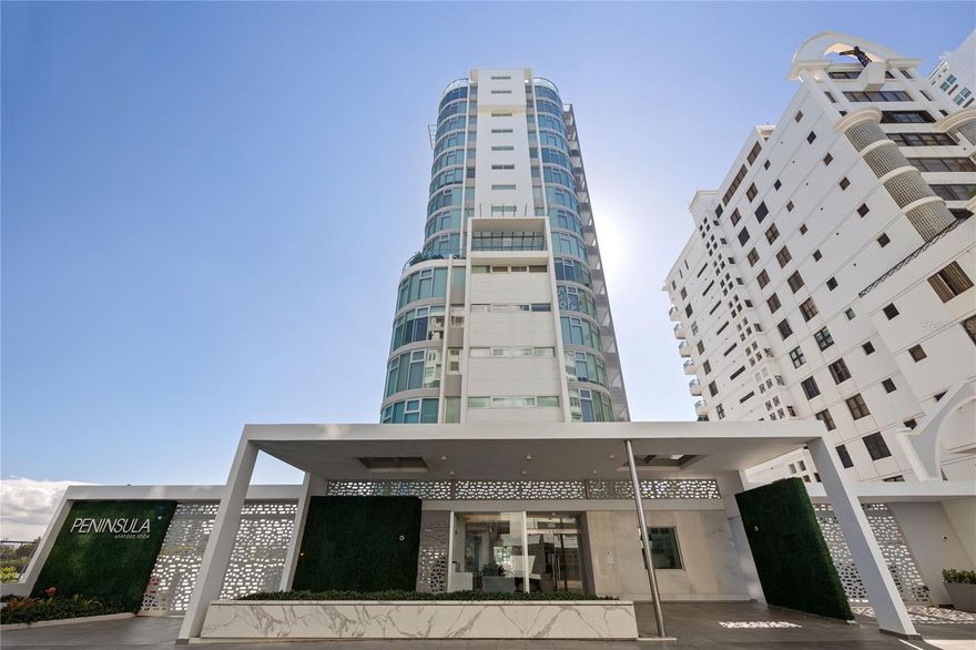 Perched serenely on the 7th floor, this 2020-built condo stands as a sanctuary of sophisticated living in the lively heart of Condado, San Juan. A true testament to architectural brilliance and tailored luxury, this residence gracefully redefines the essence of upscale living.

Crafted by revered architect Lucas E. Cambó, Peninsula unveils a modern symphony of glass and concrete, accentuating vertical proportions and curved corner glass. The result is a breathtaking panorama, where 360-degree views, luminous interiors, and comfort intertwine seamlessly. Further elevating the experience is the unique offering of one residence per floor, ensuring that every room embraces stunning views.

Peninsula boasts a 24/7 concierge, a decadent pool overlooking the Condado Lagoon, and lagoon access with storage for kayaks or paddleboards. A commitment to seamless living is showcased through features like the fully equipped gym, catering kitchen, outdoor oven, and a screening room with an accompanying kitchen.

As you step into a private Poliform designed entrance, a discreet half bath caters to guests. The unit exudes an airy ambiance with 9'6" height ceilings, and storm-proof glass and aluminum windows invite the outside beauty indoors.

Inside, a state-of-the-art kitchen and a seamlessly integrated smart home entertainment center merge effortlessly with the lagoon views. The south-facing terrace, adorned with a built-in hot tub, opens to spellbinding lagoon vistas—an exclusive and captivating space.

Four en suite bedrooms, featuring a primary suite with north-facing ocean views and an exquisitely designed bathroom boasting his and hers closets, define comfort and style. The primary suite's unique 875 square foot terrace, adorned with a trellis, stands as the sole one of its kind in the building—a realm of privileged space and unique ocean views.

With a capacious laundry room and pantry, a sprawling 3,013 square feet of living area, an expansive 875 square foot terrace, three parking spaces and storage space, this condo transcends the ordinary. 

In this residence, every element is a deliberate stroke, and every detail narrates a story. This is more than a home; it's a curated experience, where luxury is nuanced, and living is elevated to an art form.

This is elegance, redefined.