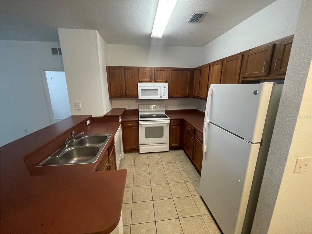 Photo of 8102 Lillies Way #204, Orlando, FL 32825 (MLS # O6449433)