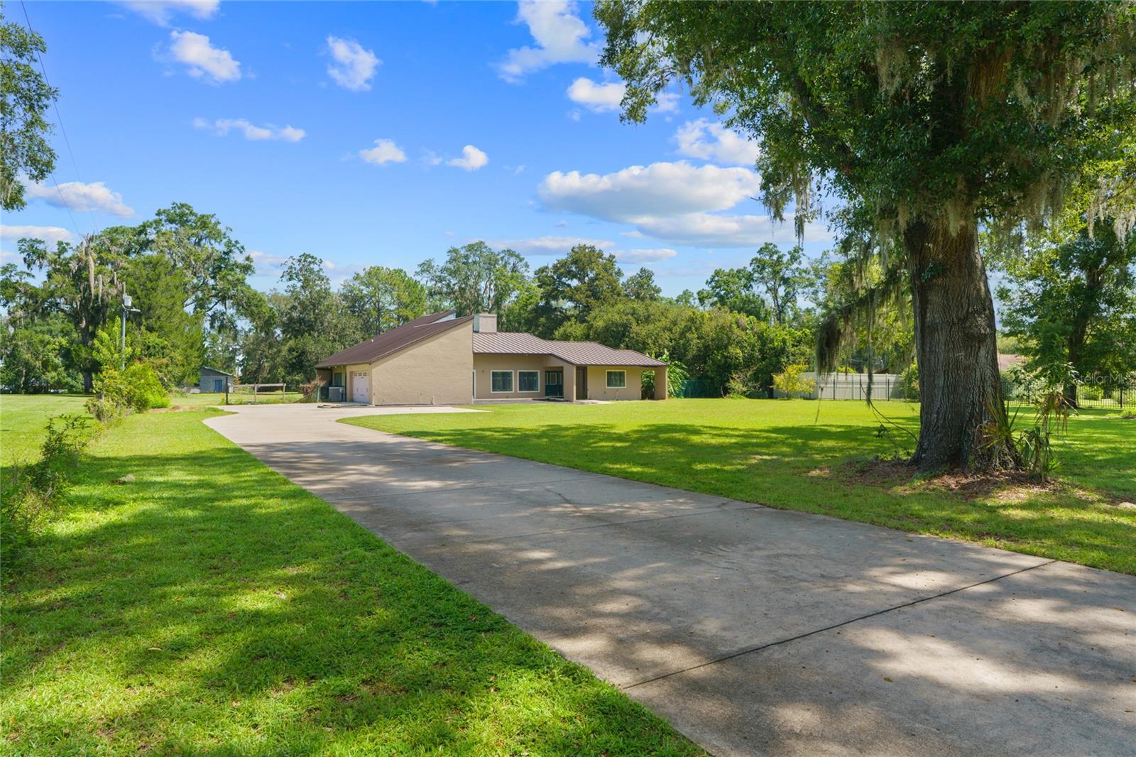 Need seclusion and a prime location? Discover this 5-bedroom, 2.5-bath pool home on 2.5 acres in Southeast Ocala! Personalize it with your final touches. Perfect for the start of the school year, this property boasts a stunning stone wood-burning fireplace and a spacious, open layout. Recent upgrades encompass new Pella wood-framed windows, three electric panels, updated exterior lighting, and a generator backup switch (2023). The HVAC ductwork on one unit was replaced in 2022. New roof installed in 2024. Arrange your viewing now!