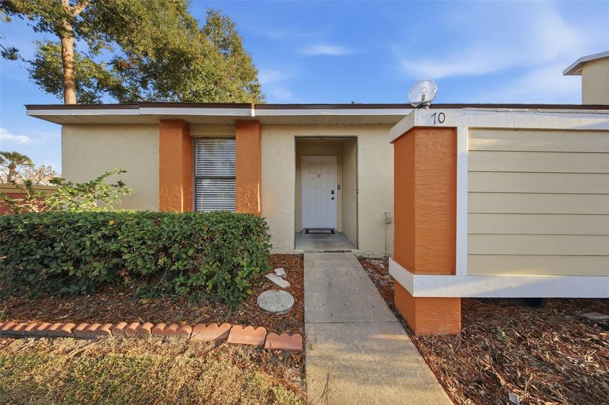 Move in ready corner unit featuring tile flooring throughout and a spacious enclosed back porch that adds flexible living space for everyday use or entertaining. Recent updates include a roof replaced approximately one year ago and a water heater replaced about eight months ago. Conveniently located approximately three miles from the Florida Turnpike, offering easy access for commuting and travel, while still providing a comfortable residential setting. Ideal for buyers seeking a well maintained home with recent improvements.