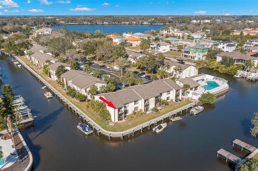 Waterfront in Tarpon Springs!  GULF ACCESS! Keep your boat right out back for free! Lease this fully furnished 2bd/2ba 2nd level condo and enjoy some of the best water views of the canal and watch the dolphins and manatees frolic. Fish from right out back or from the community dock/boardwalk. This corner/end unit is ready to move in. Beautiful wood floors and tile throughout. Lots of closet/storage space. Washer/Dryer included. Amenities include a heated, waterfront pool, clubhouse, waterfront dock/boardwalk, kayak launch, gazebo picnic area, kayak, canoe and bike storage racks. Walk to downtown Tarpon Springs and enjoy restaurants and shopping. Close to Sunset Beach and Fred Howard Park, Tarpon Springs Sponge Docks. Medical facilities/hospitals close by. Many golf courses. Close to International airports. Go for a walk/run on the 53 mile long Pinellas Trail. A beautiful place to live!