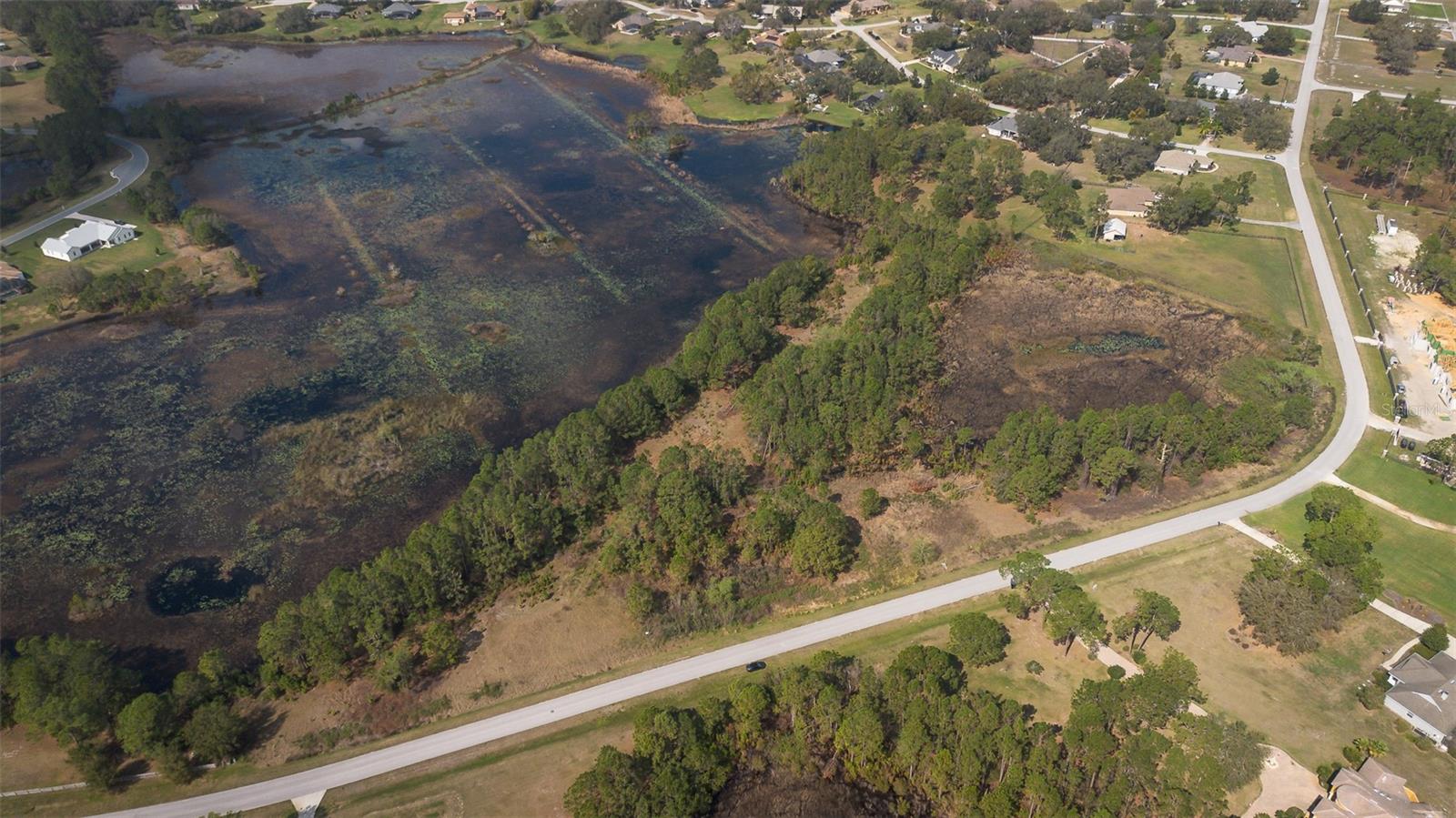 HUGE PRICE IMPROVEMENT!! MOTIVATED SELLER - Discover the perfect place to build your dream home in the highly sought-after Arrowtree Reserve community in Clermont, Florida! This incredible 6.5 acre lot is one of the few available in this well-established neighborhood, surrounded by beautiful custom homes on spacious properties. Zoned for horses and other small farm animals, this is where you can have space for it all. With a perfect mix of cleared and wooded land, over 900 feet of road frontage on Arrowtree Blvd, and a raised home site and driveway path, this property is truly ready for your vision to unfold! City-approved plans and a completed survey are available, making the building process smooth and stress-free. Enjoy the serenity of nature while still being just minutes from Clermont's charming downtown, where you'll find fantastic shopping, dining and year-round events. This prime location is also near major highways and the turnpike making your commute or adventures an easy journey.
If you have been looking for a quiet place to call home, but still close to the city ... don't wait any longer. Opportunities like this don't come around often - don't miss your chance to own this spectacular piece of land!