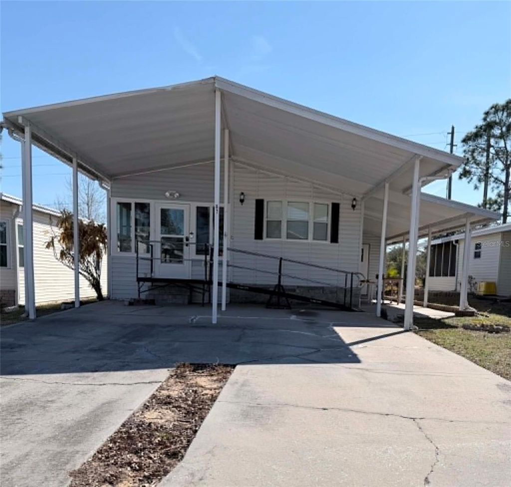 Photo of 50989 Highway 27 #87, Davenport, FL 33897 (MLS # OM724340)