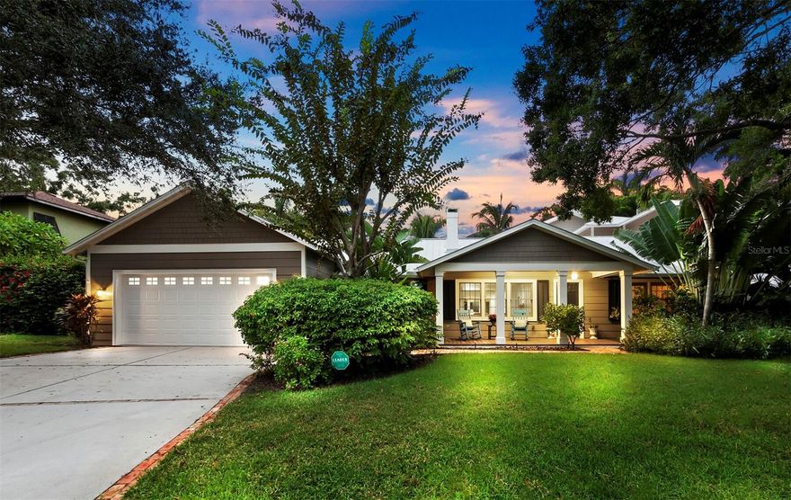 This classic remodeled home is nestled in one of the most desirable areas in Sarasota. Imagine being in close proximity to Southside Village, Morton’s Market, top-ranked Southside School, downtown Sarasota’s arts and cultural district, and world-renowned beaches. Under a canopy of trees, light trickles through to highlight a lush tropical front yard showcasing the silhouette of this home. The spacious layout features 5 bedrooms and 5 ½ bathrooms encompassing two levels with 4,956 interior square feet. In addition to 5 bedrooms there is a bonus room, office, and a flex room that could be used as an exercise room or a 6th bedroom. The inviting front porch includes space to relax. Welcoming soft coastal hues and natural light complement the view upon entry which extends to the spectacular backyard and custom pool. The classic allure of Old Florida permeates this impressive home. Special touches such as pecky cypress ceilings, crown molding, plantation shutters, built-in features, wood, and tile floors pair effortlessly with the gourmet kitchen and great room. A large dining room with a beautiful wood planked ceiling provides functional space between the front living room and impressive great room with sliders that extend the living space outdoors. The airy flow of the great room and kitchen area creates the ideal space for entertaining. The chef’s kitchen is complete with an expansive breakfast bar, chic tile backsplash, granite countertop, stainless appliances, gas range, big walk-in pantry, and wine cooler. The staircase leads to a flexible bonus room that offers a wet bar, mini refrigerator, and balcony overlooking the lush backyard, and guest suite with en-suite bath. A spacious owner’s retreat with a spa-like en-suite bathroom boasts a wall of windows with access to the pool and stunning views. This open floorplan includes a mother-in-law en-suite with a morning kitchen, plus a junior suite with 2 bedrooms and bath. A built-in desk with cabinetry elevates the home office space. Enjoy the covered exterior living area with an outdoor kitchen and plenty of room for relaxing. The salt-water pool and heated spa add to the appeal of this expansive space. Lush tropical foliage with fencing offers a desirable backyard privacy to thoroughly enjoy Sarasota’s outstanding weather. Other noteworthy features include gas fireplace, tankless water heater, new outdoor grill, newer pool pump, and two car garage. Come live and play in the heart of Sarasota.